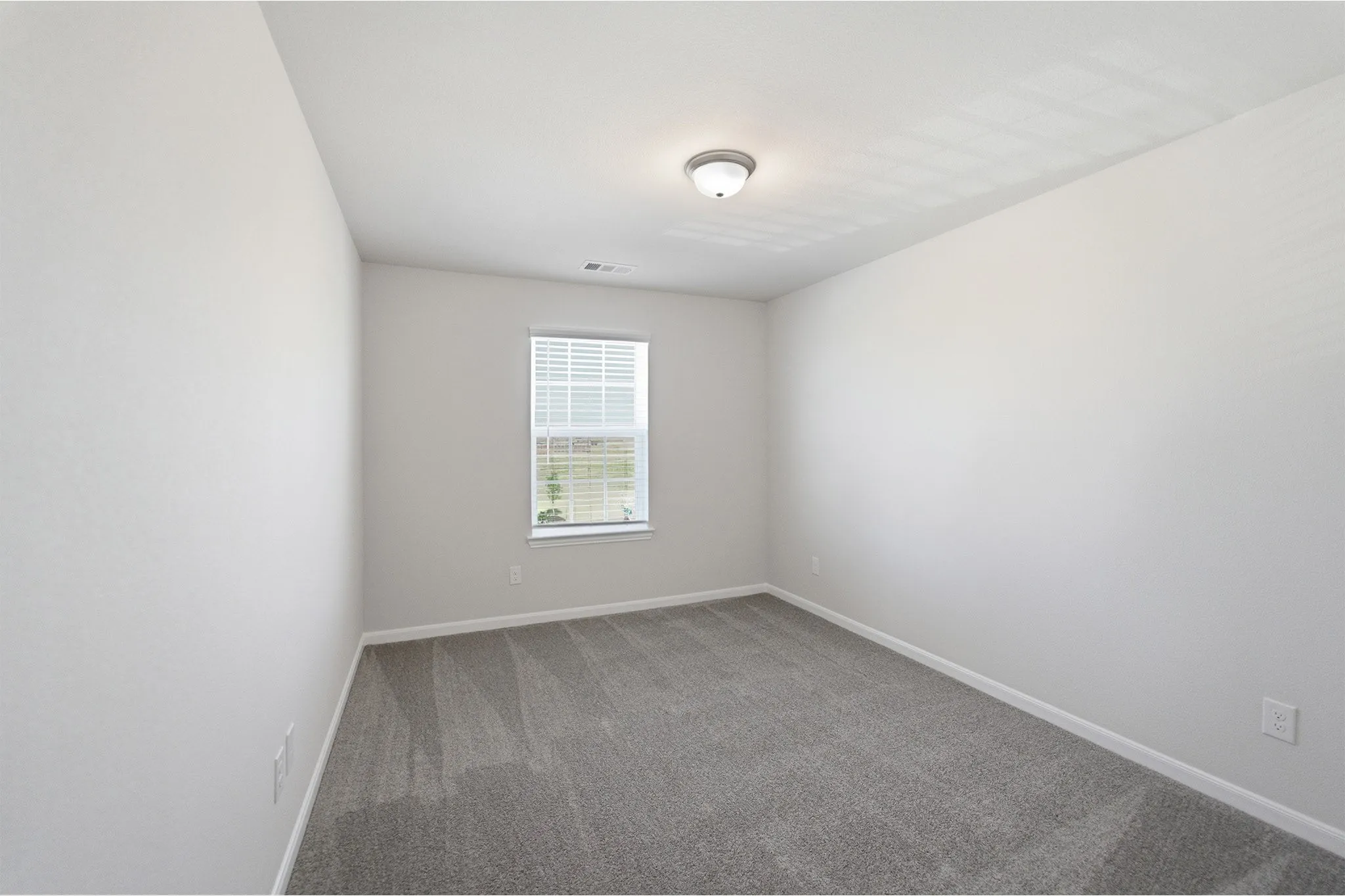 Neutral tone wall paint with a single window featuring horizontal blinds