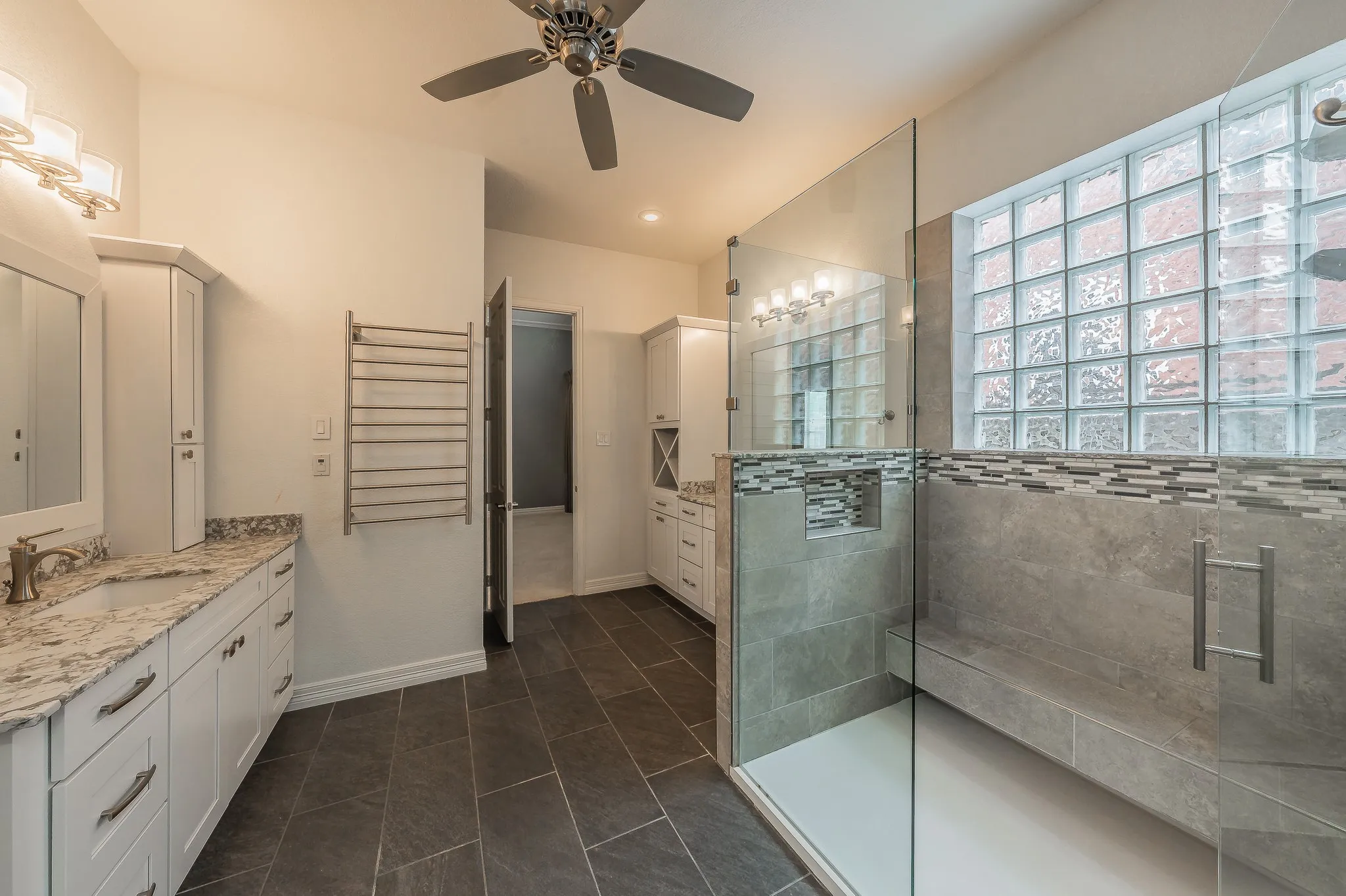 Giant walk in shower, separate vanities, tons of storage space and heated towel rack.