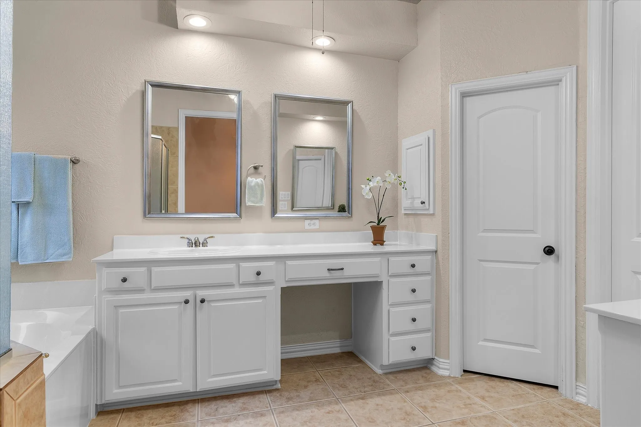 Split Vanities. Hers has knee space for vanity chair