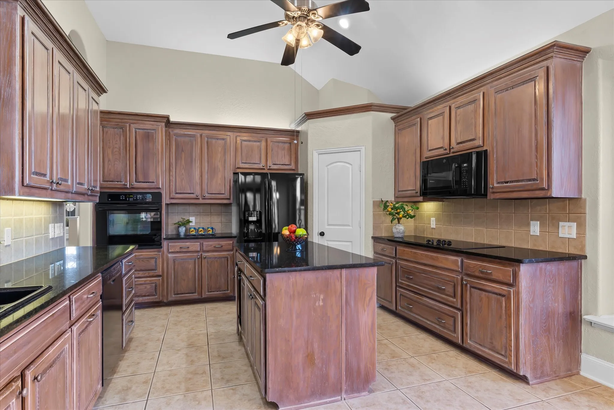 Handsome Kitchen with Granite Counters and tile backsplash