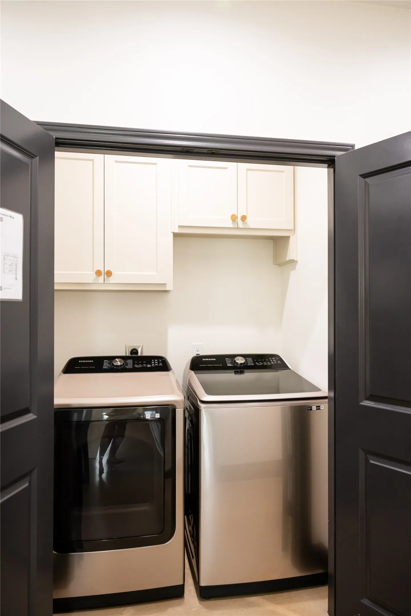 Laundry room with washer and dryer and cabinet space