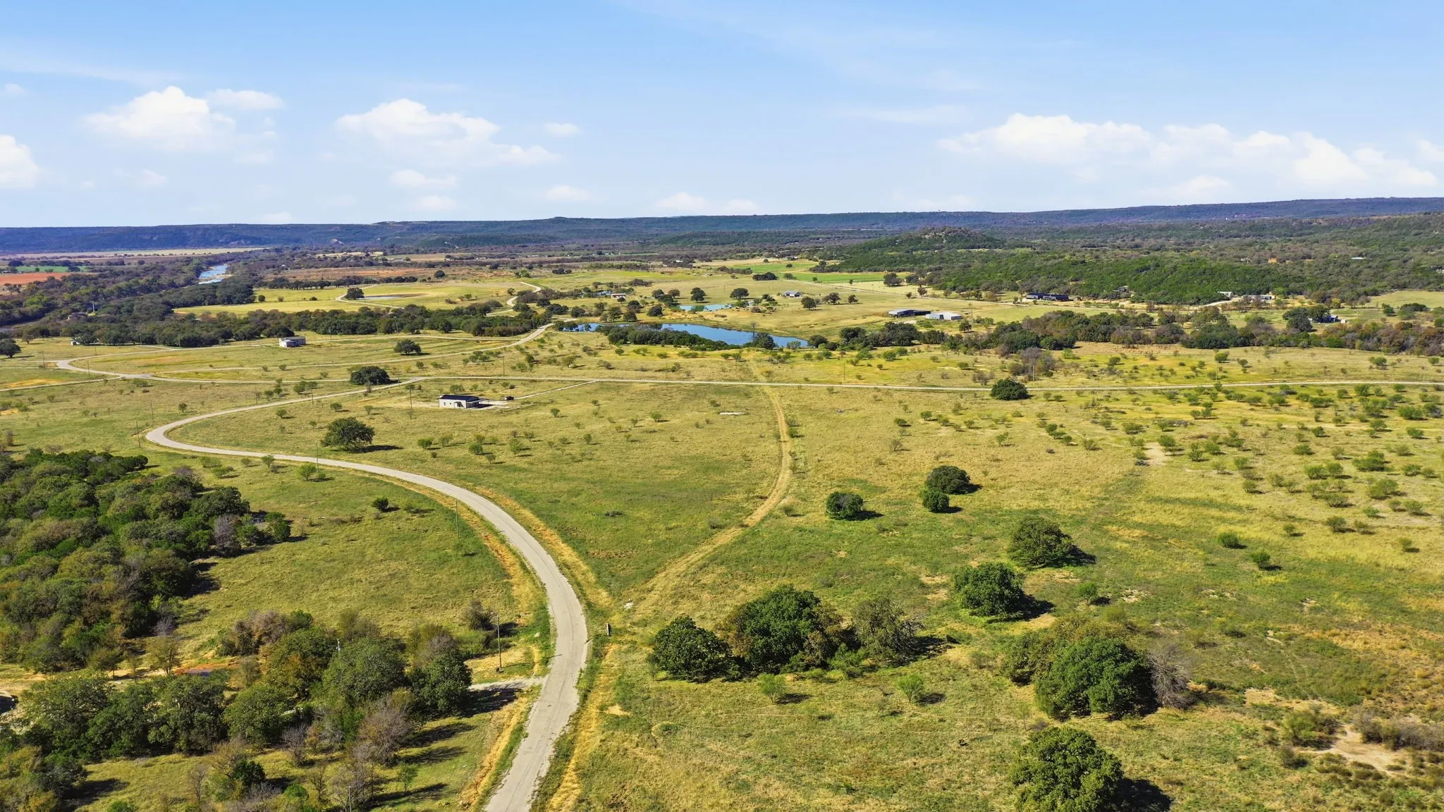 View of property location with rural landscape and a large body of water