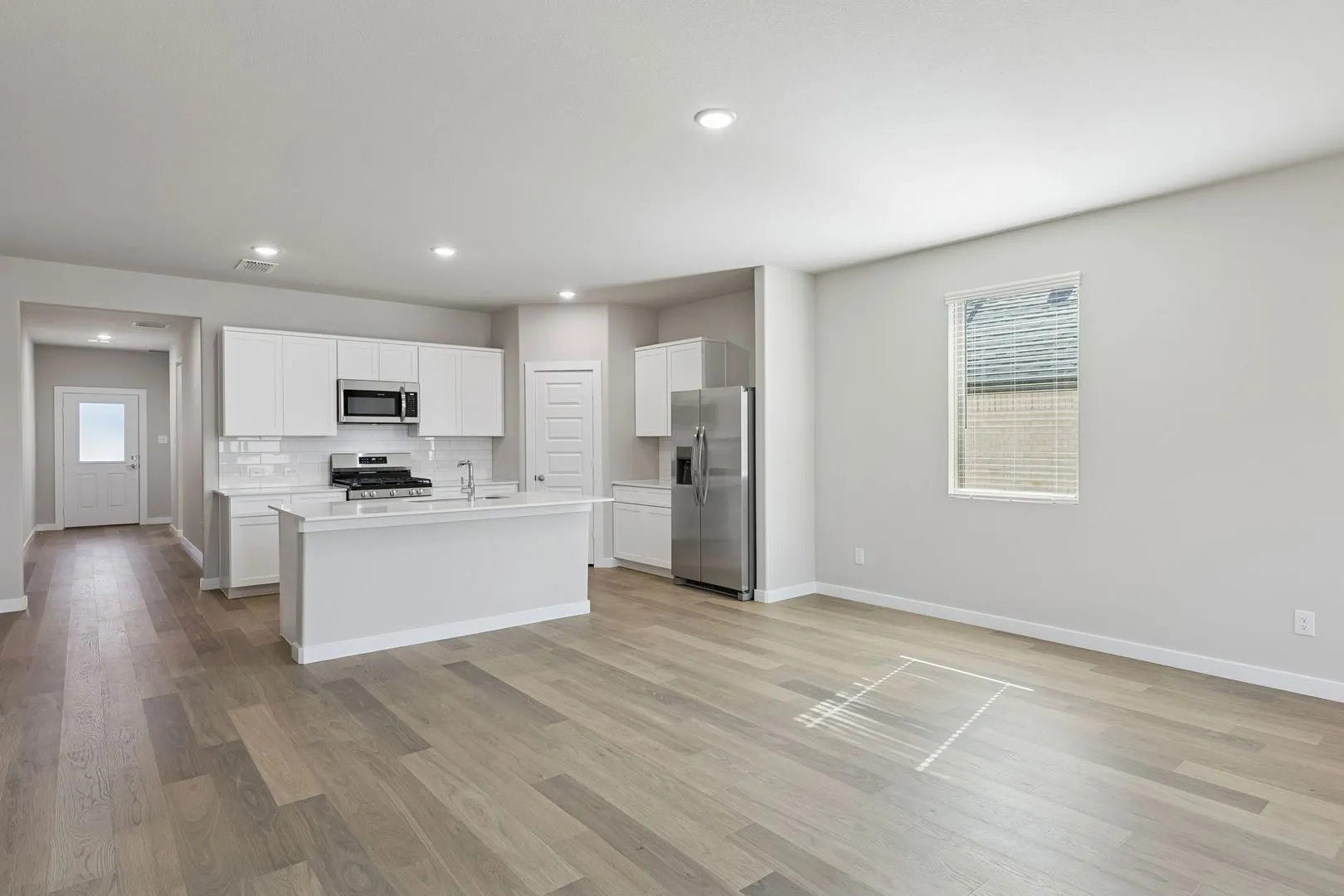 Kitchen and Dining Room in the Holden home plan by Trophy Signature Homes – REPRESENTATIVE PHOTO