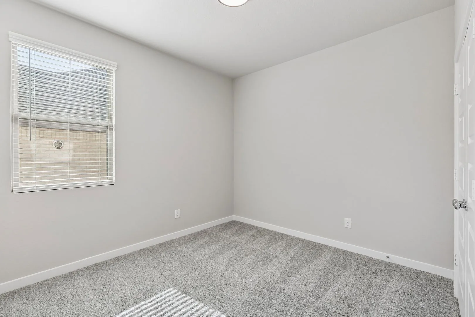 Bedroom in the Holden home plan by Trophy Signature Homes – REPRESENTATIVE PHOTO
