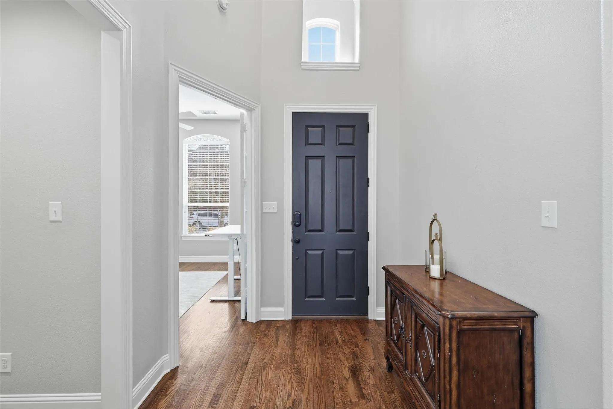 Entrance foyer featuring solid wood floors