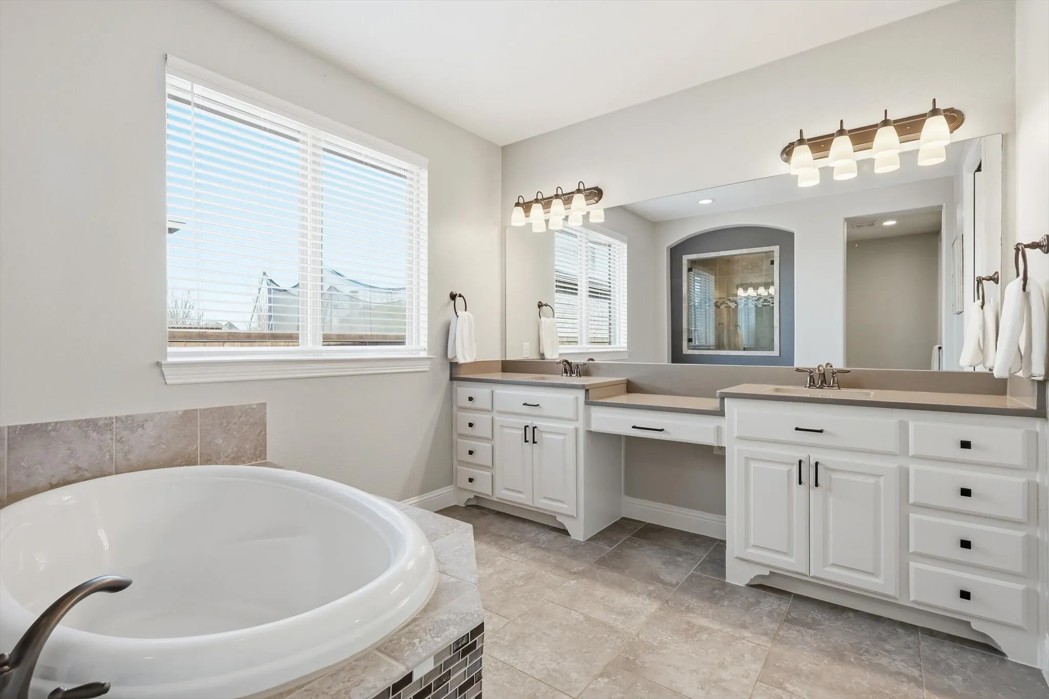 Dual vanities in primary bathroom