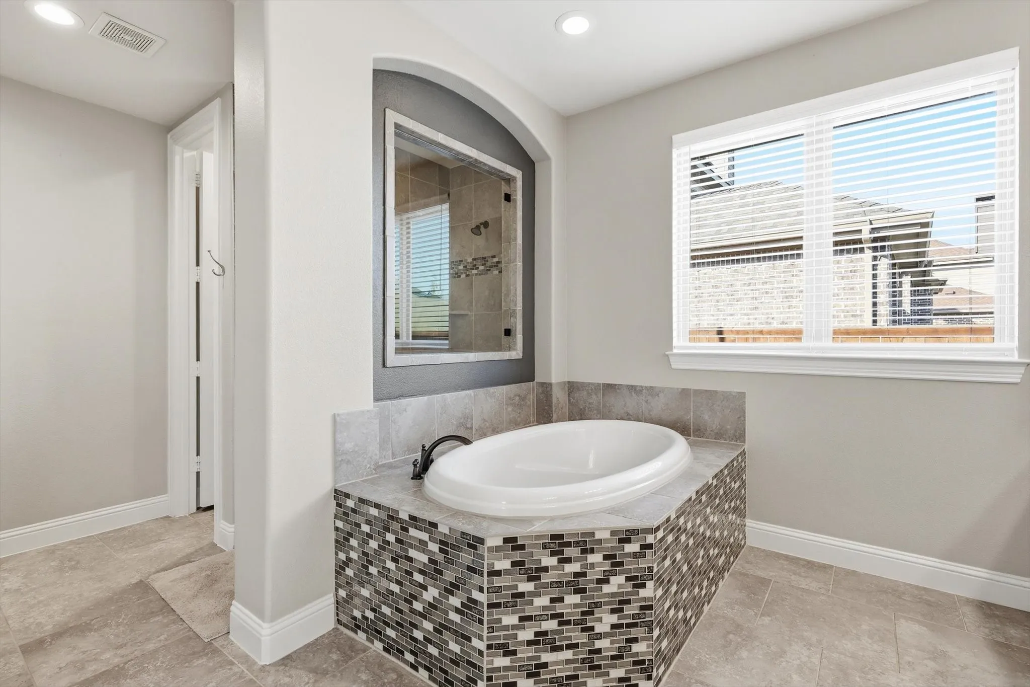 Spa-like bathroom with soaking tub and separate shower