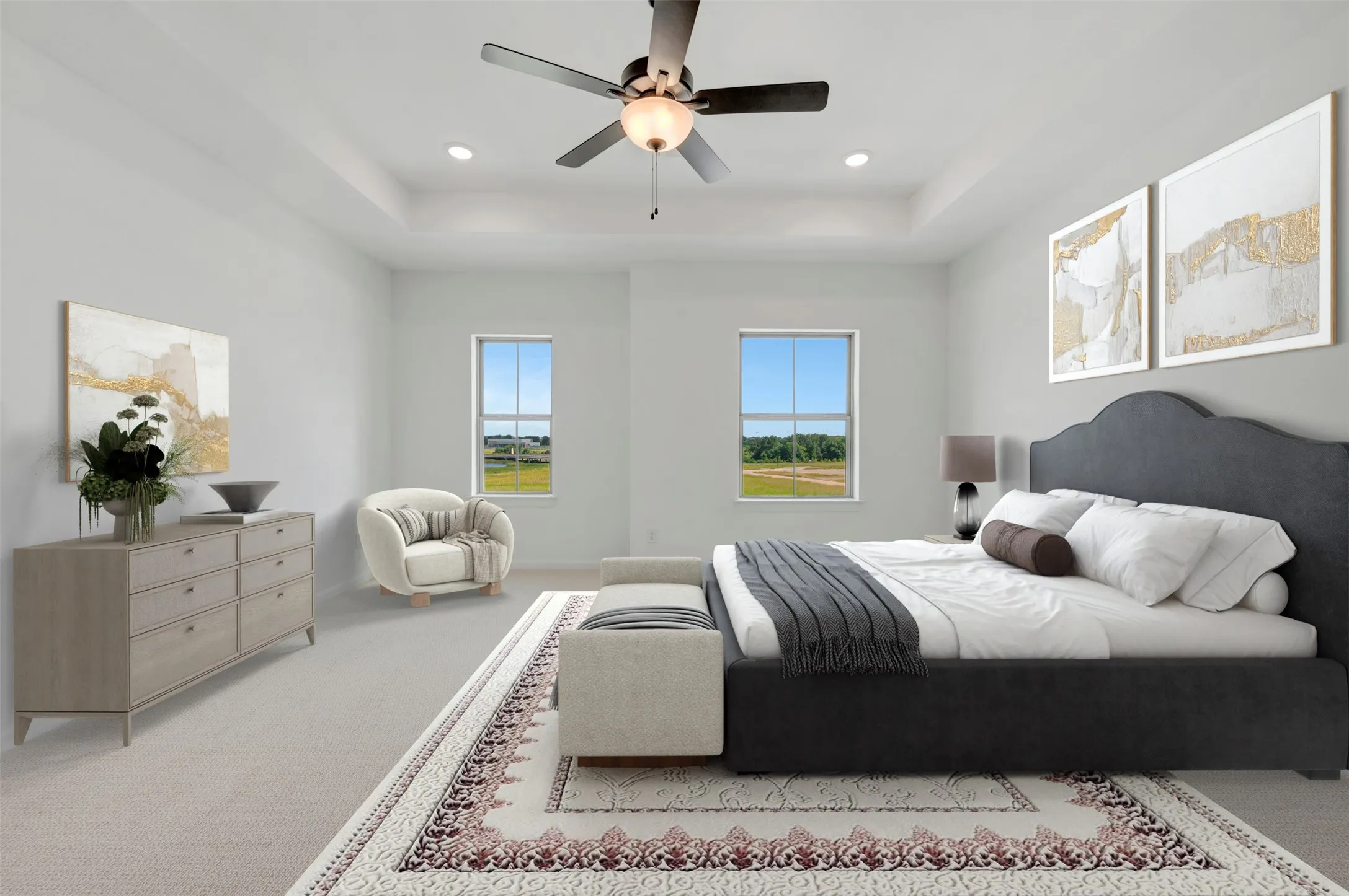 Room featuring a tray ceiling, recessed lighting, and a ceiling fan with light fixture