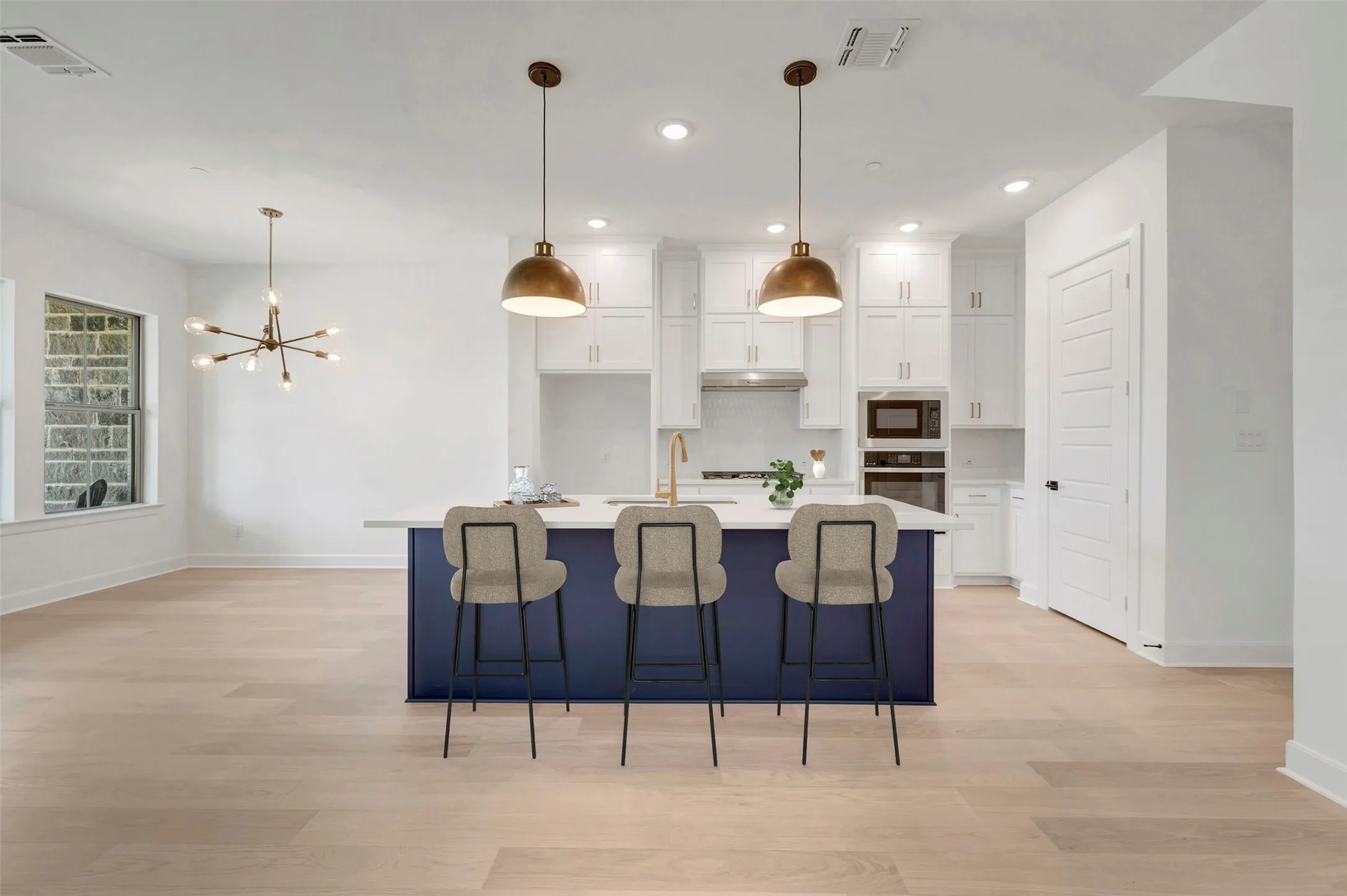Contemporary kitchen island with a white countertop and blue base