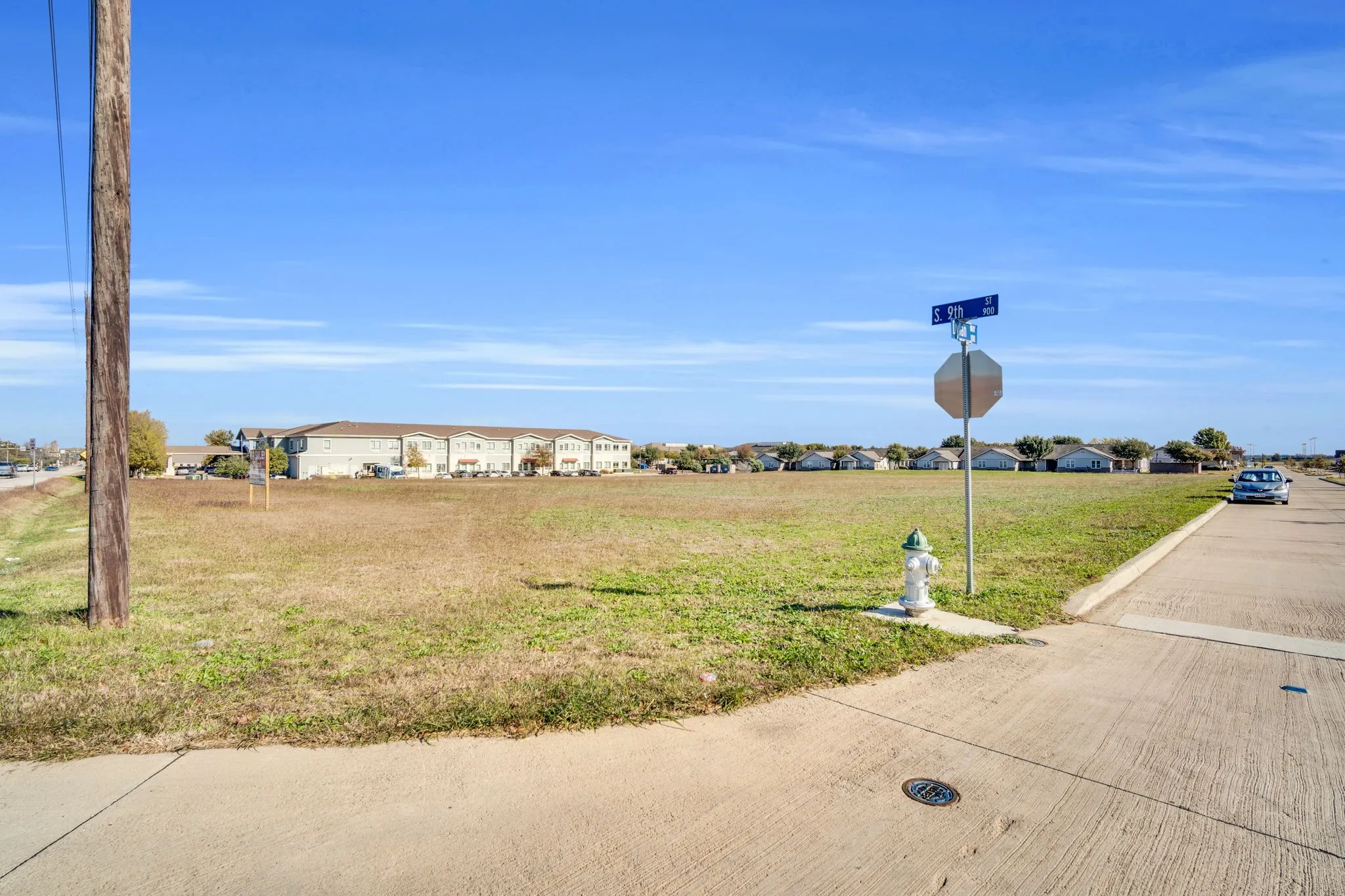 Ground view of the property showcasing convenient access from the adjacent roadway.