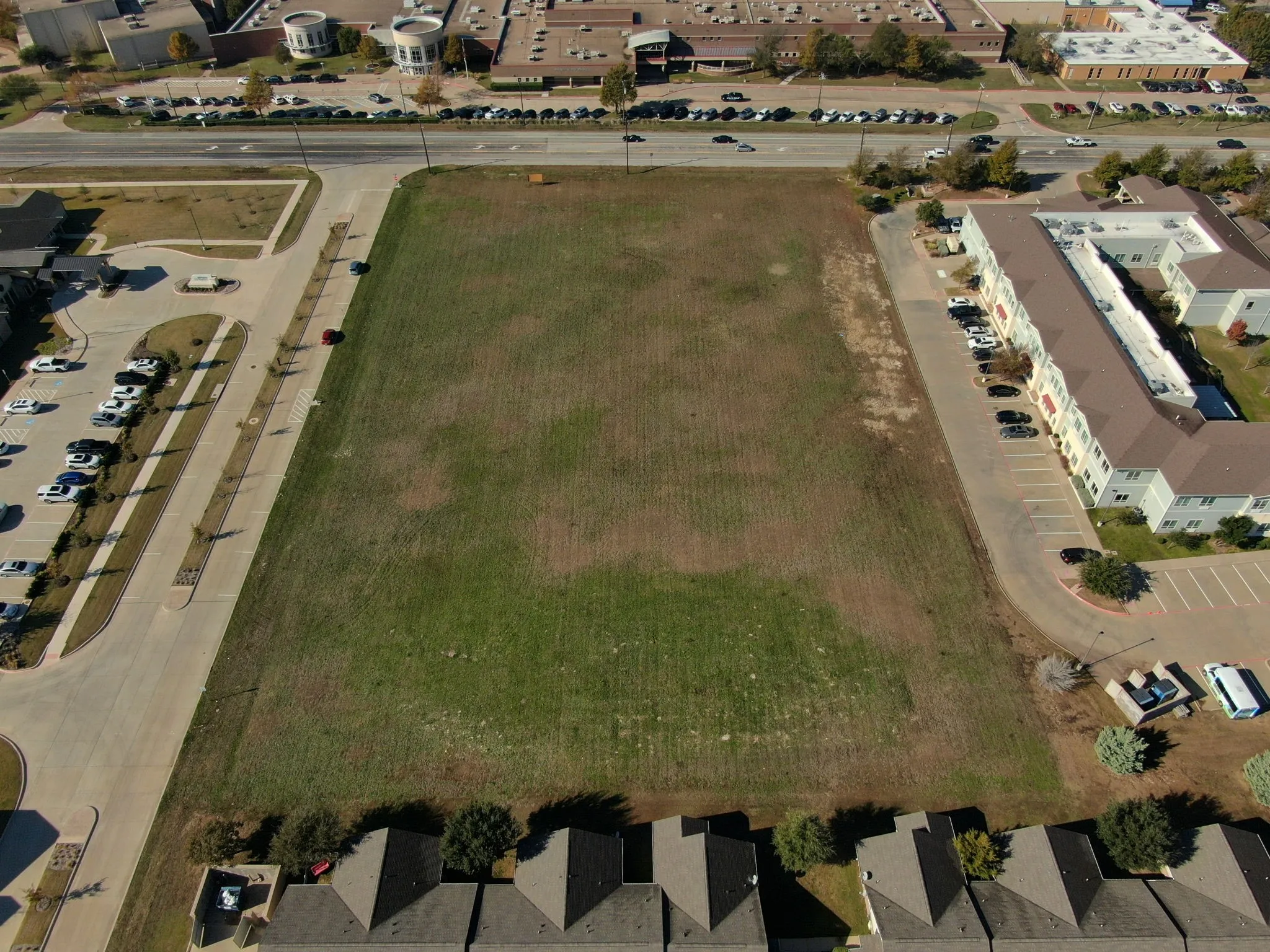 Aerial back view of the property, showing the full depth of this versatile commercial lot.