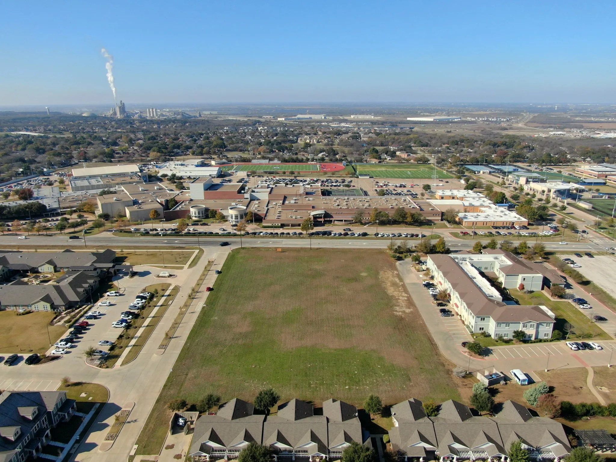 Expanded aerial view highlighting the surrounding development and strong growth potential of the area.