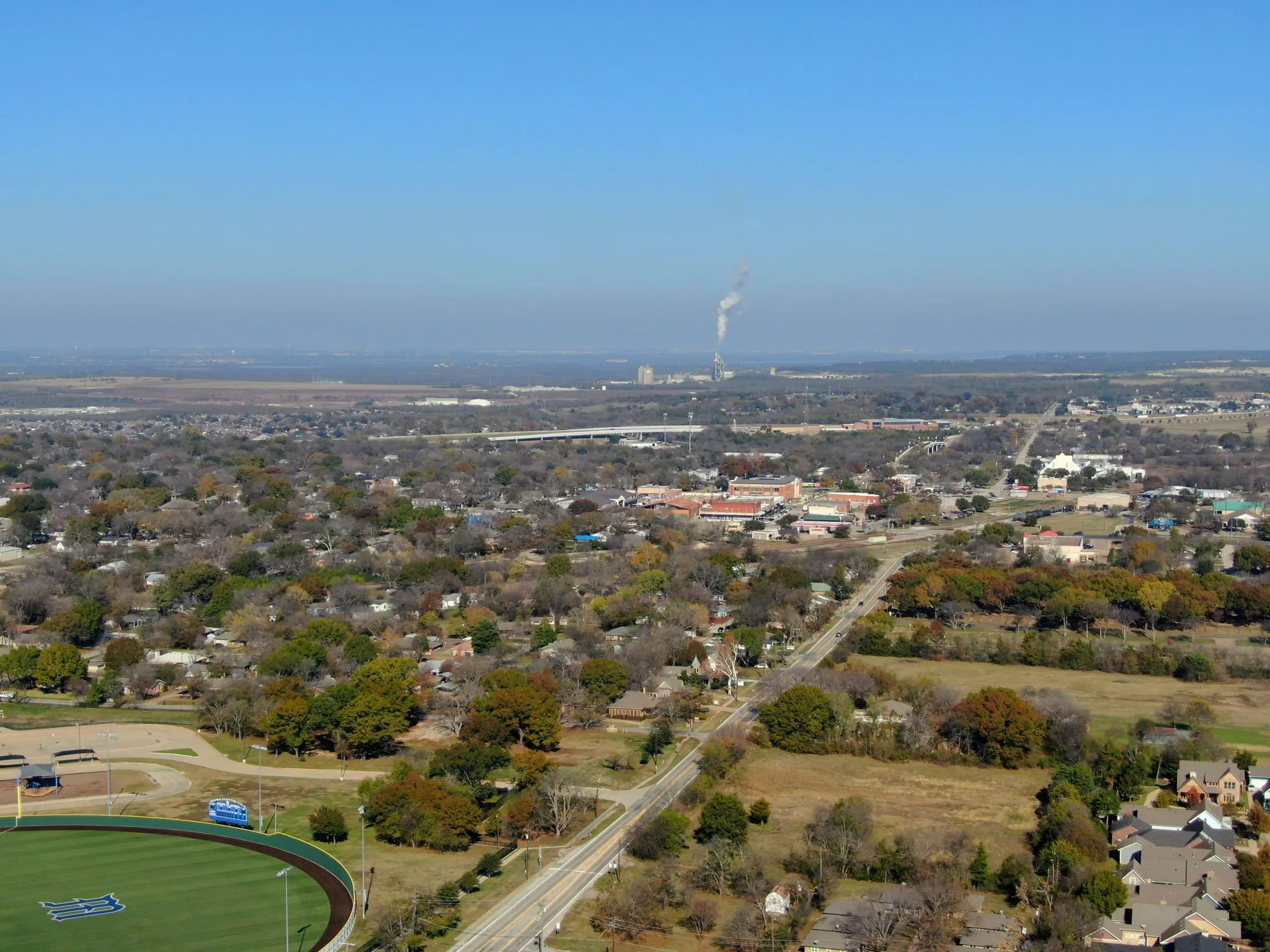 Aerial view highlighting the impressive growth surrounding the property, underscoring its investment potential.