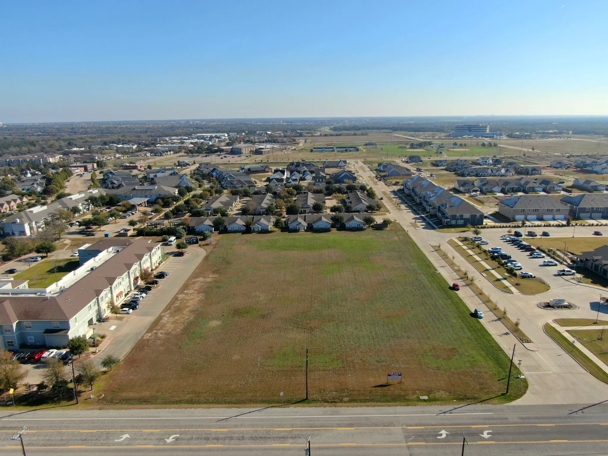 Aerial front view highlighting the property's excellent road frontage and easy accessibility.