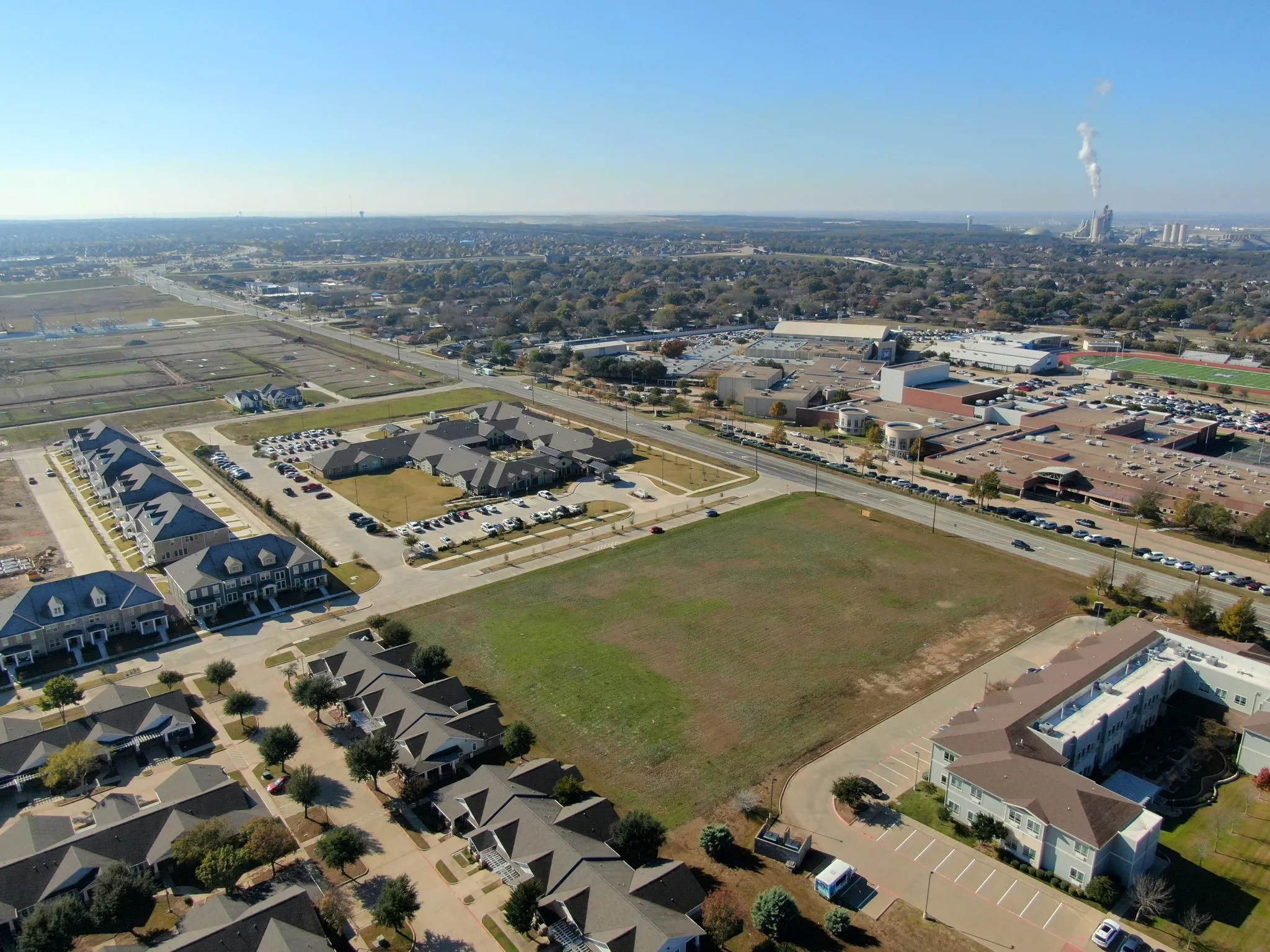 Additional aerial angle showcasing the property's shape, size, and strategic positioning.