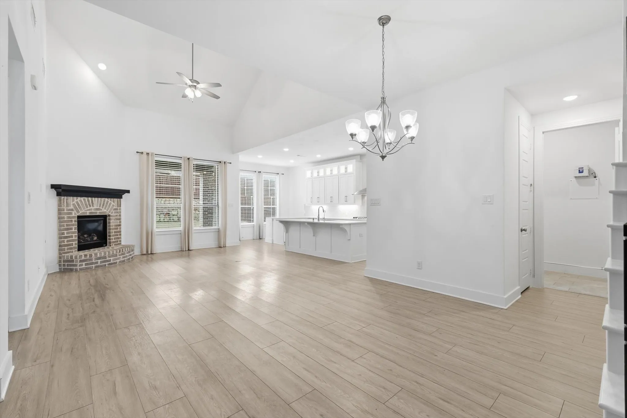 Polished view of dinning space, living and kitchen
