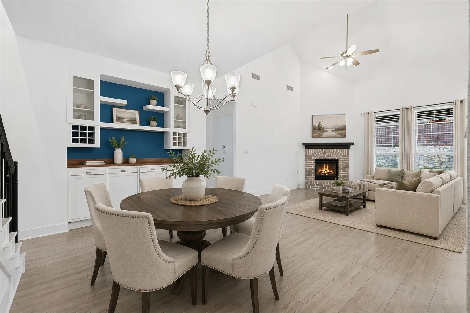 Open concept dinning space with built in cabinets with lighting and glass fronts, inclusive of soft close cabinets. *Virtually Staged