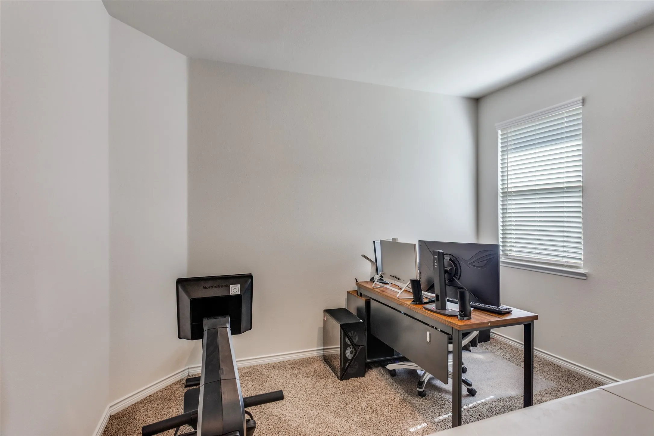 Office area with light colored carpet