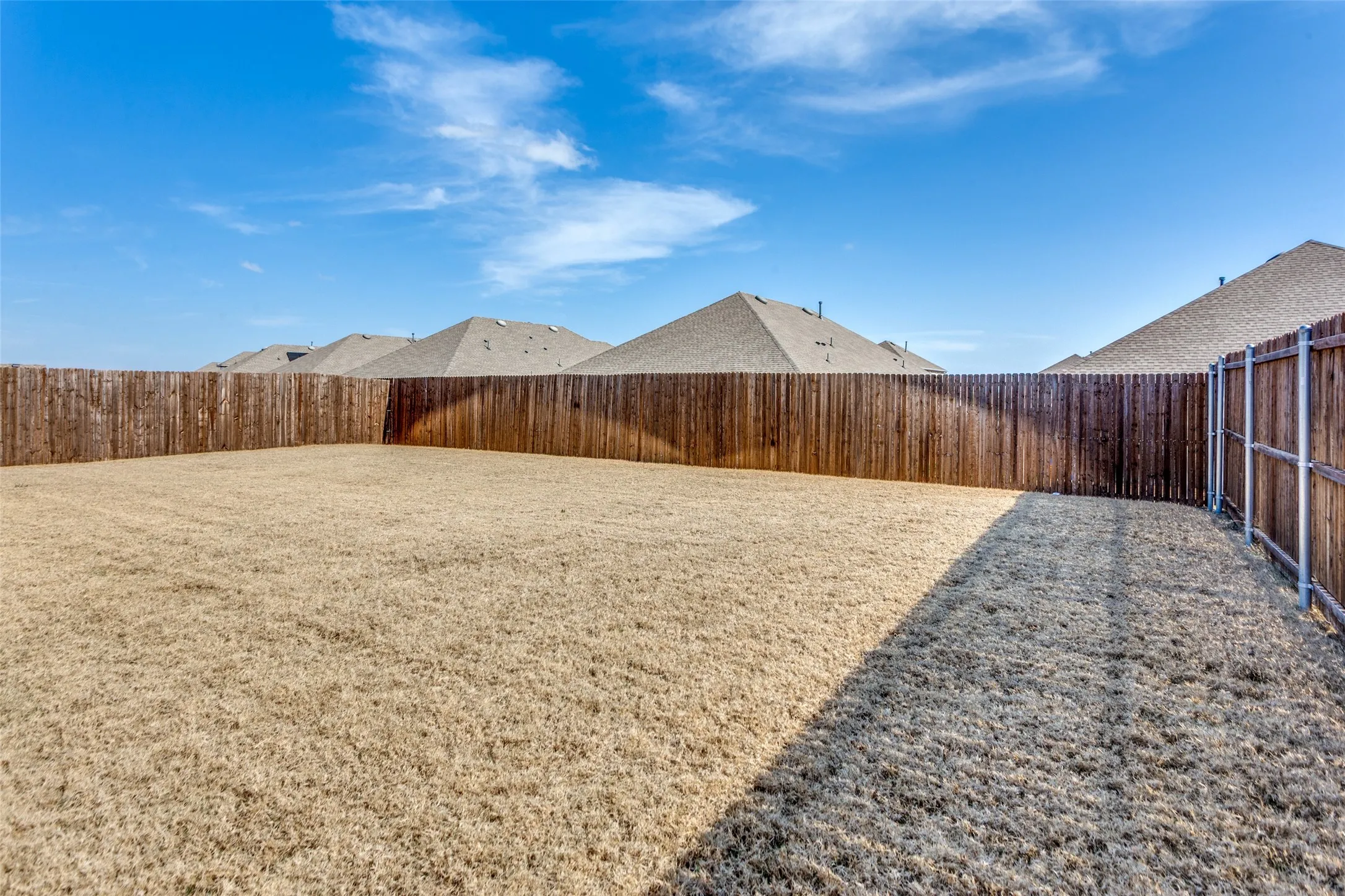 View of fenced backyard
