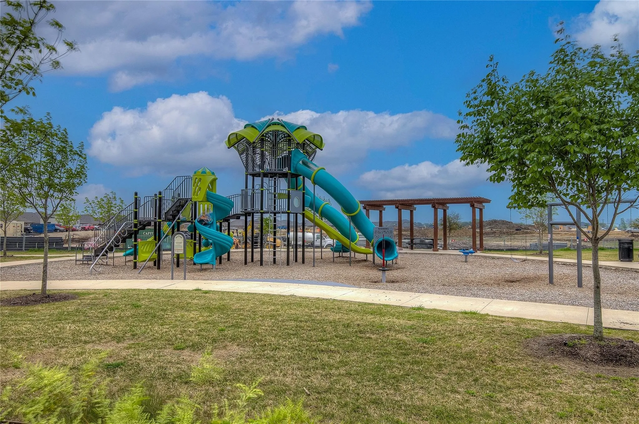 Communal playground featuring a lawn