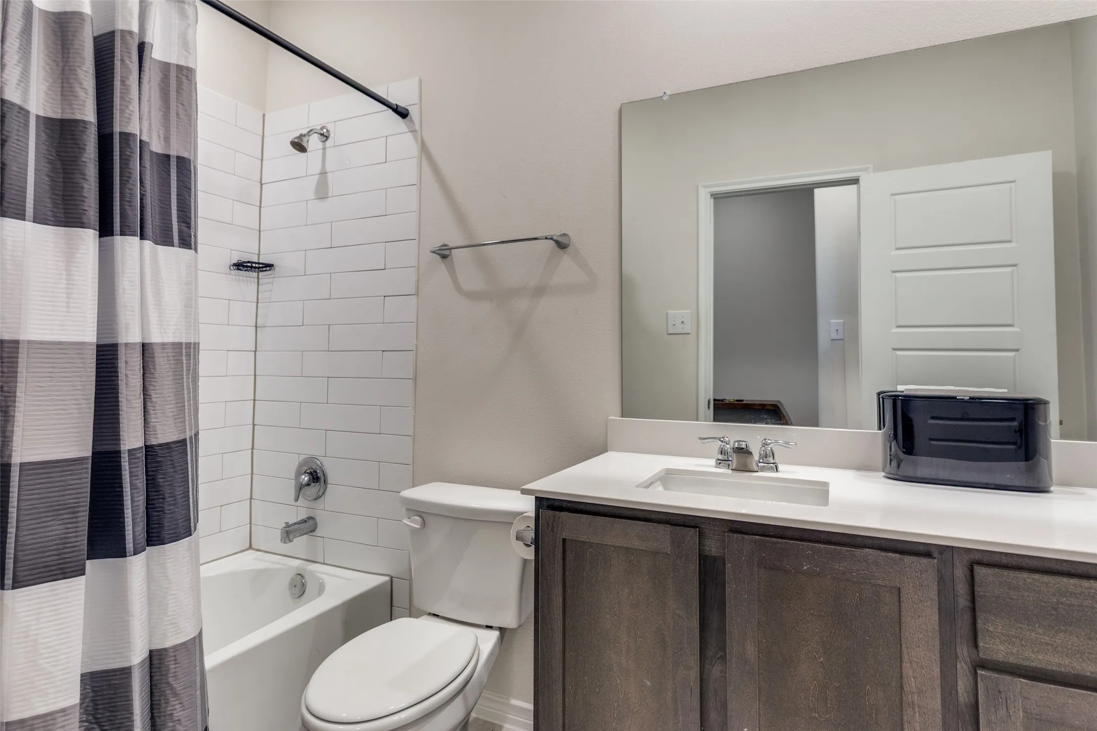 Full bathroom featuring vanity and shower / bath combination with curtain