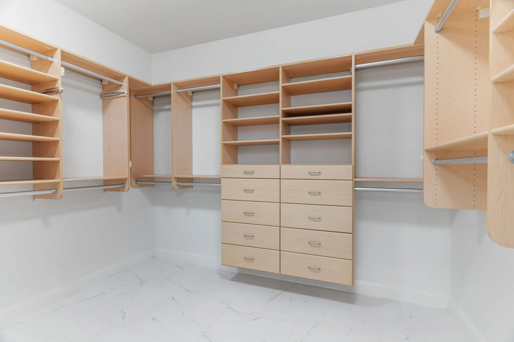 Custom appointed primary closet is sure to please those who demand tidiness!