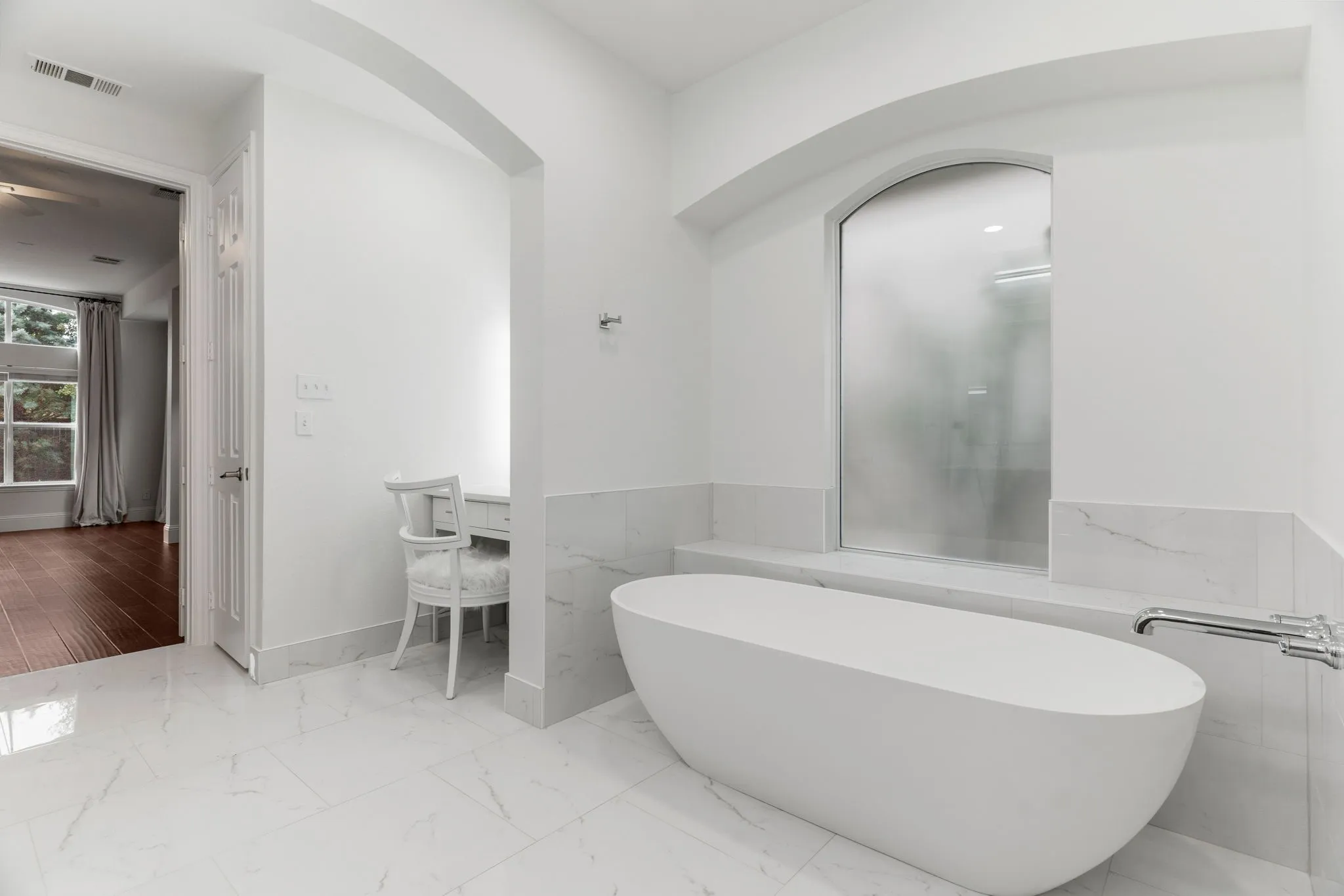 Totally remodeled primary bath boasts this luxury spa bathtub, new cabinetry, fixtures, mirrors & beautiful walk-in shower.