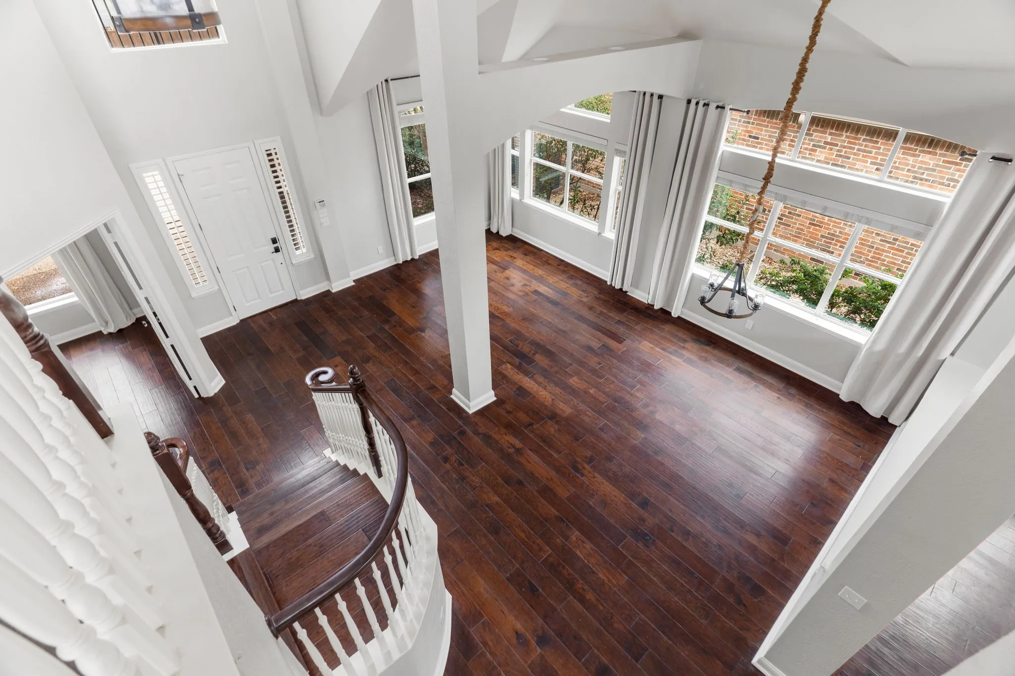 You can tell how much natural light is in this home from the wall of Windows and very high ceilings!