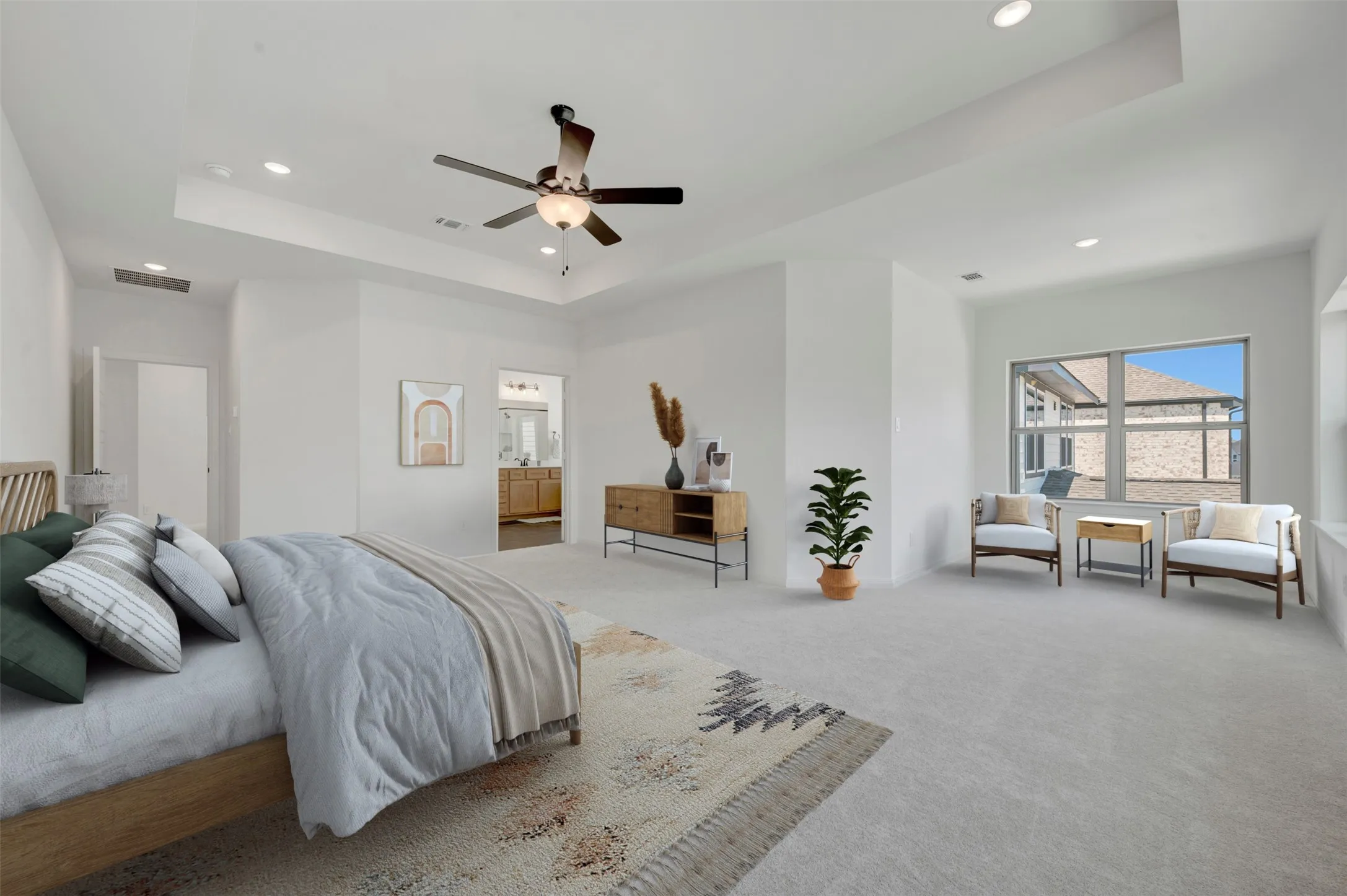 Expansive room with recessed lighting, a ceiling fan, and large windows