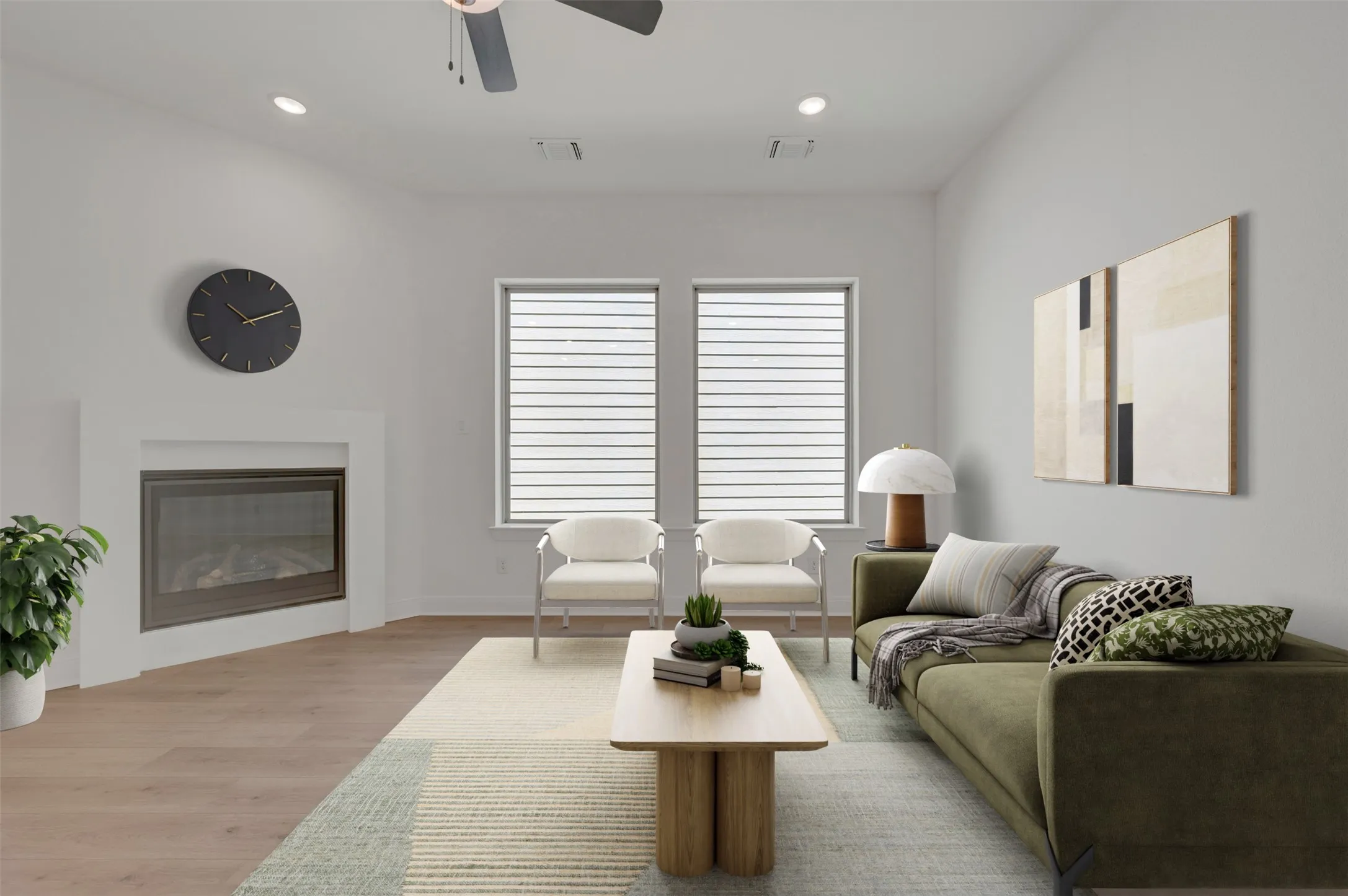 Recessed lighting, wood-finish flooring, ceiling fan, contemporary fireplace, and two windows with blinds