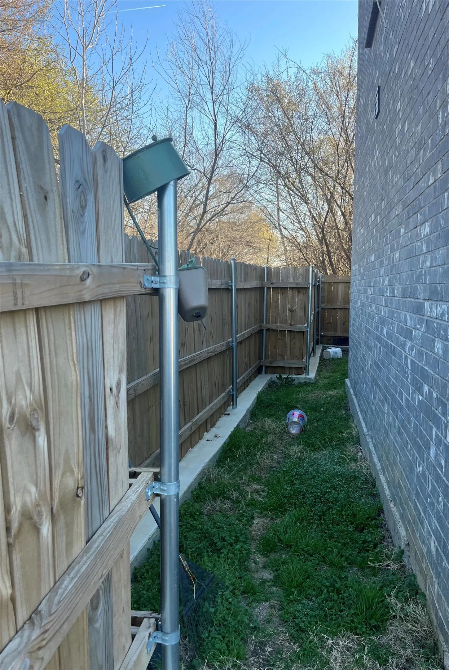 Side area of home. Entry to rear of home.