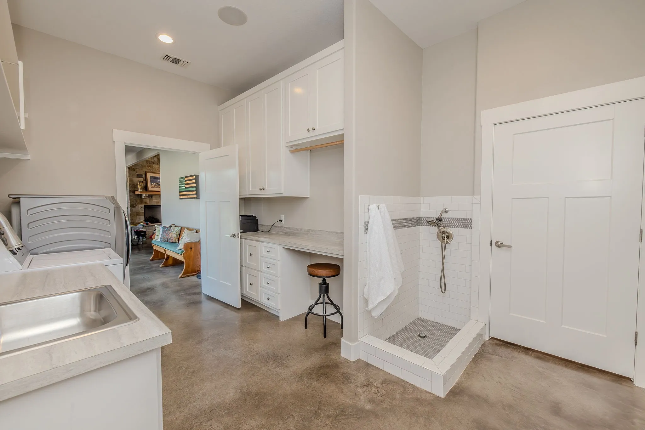 Huge laundry room with convenient dog washing area right as you enter from garage, so smart!