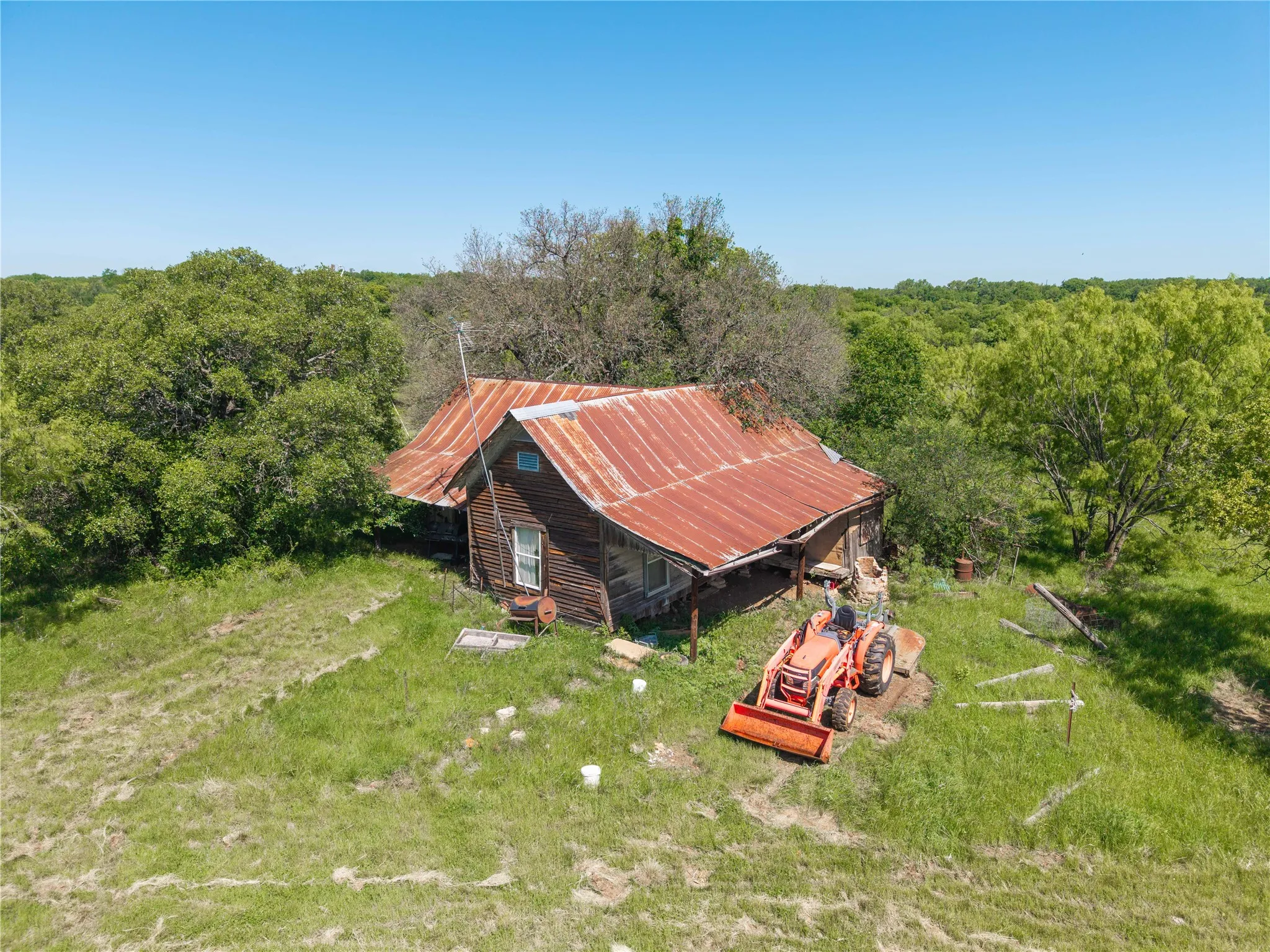 Rustic exterior structure with a corrugated metal roof