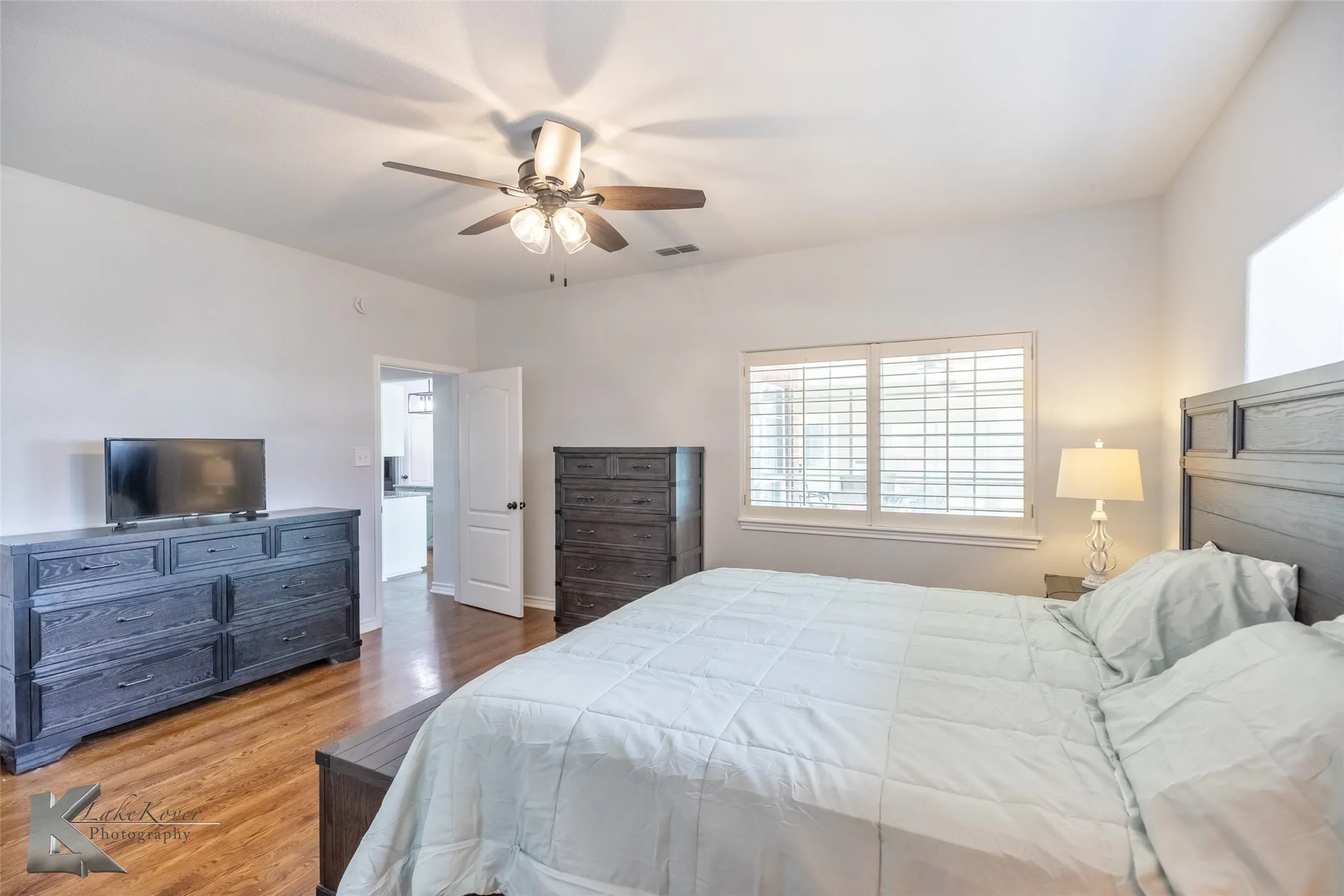 Bedroom featuring wood finished floors and a ceiling fan