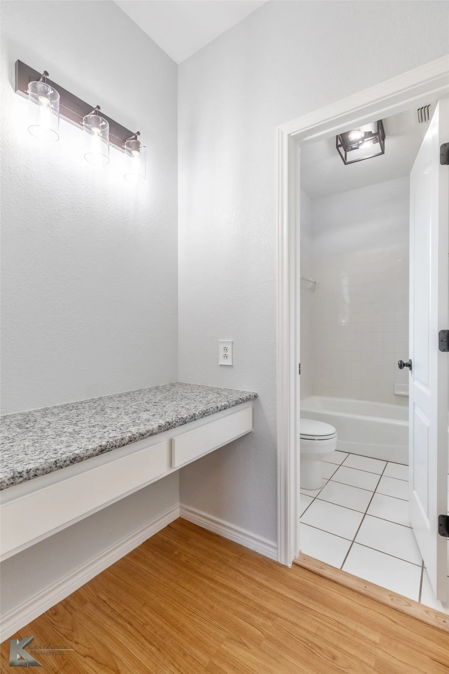 Bathroom featuring toilet and wood finished floors