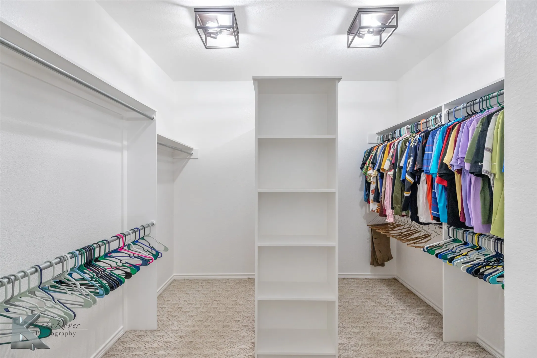 Spacious closet with carpet flooring