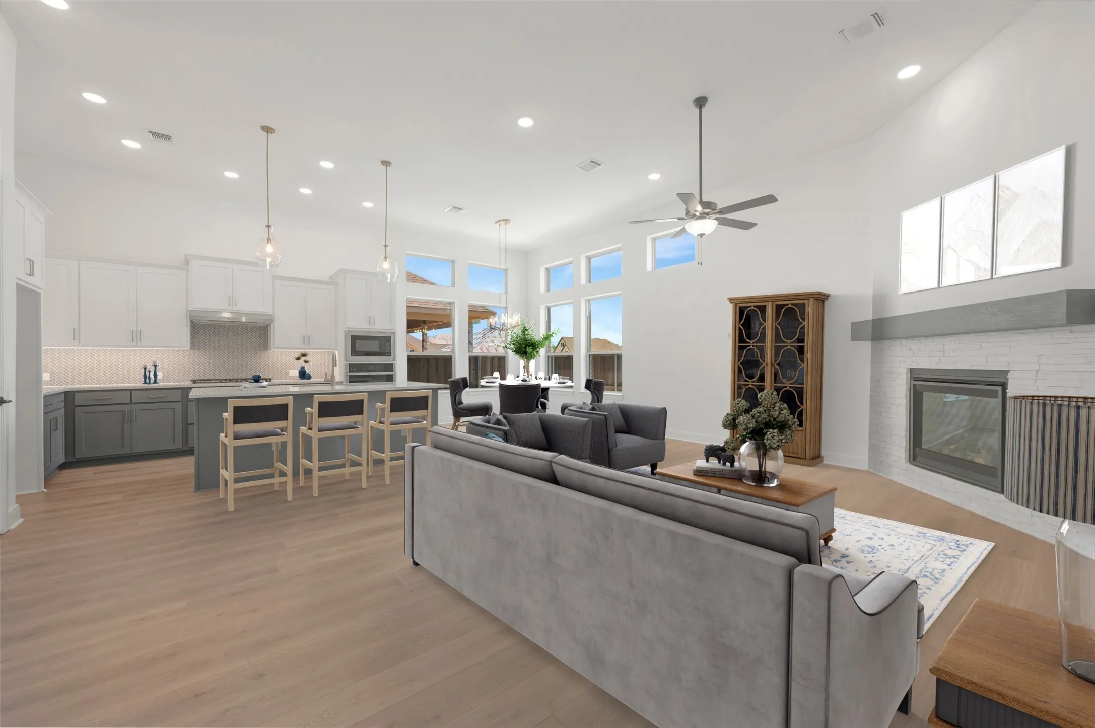 Expansive open-concept living area featuring wood-finish flooring throughout