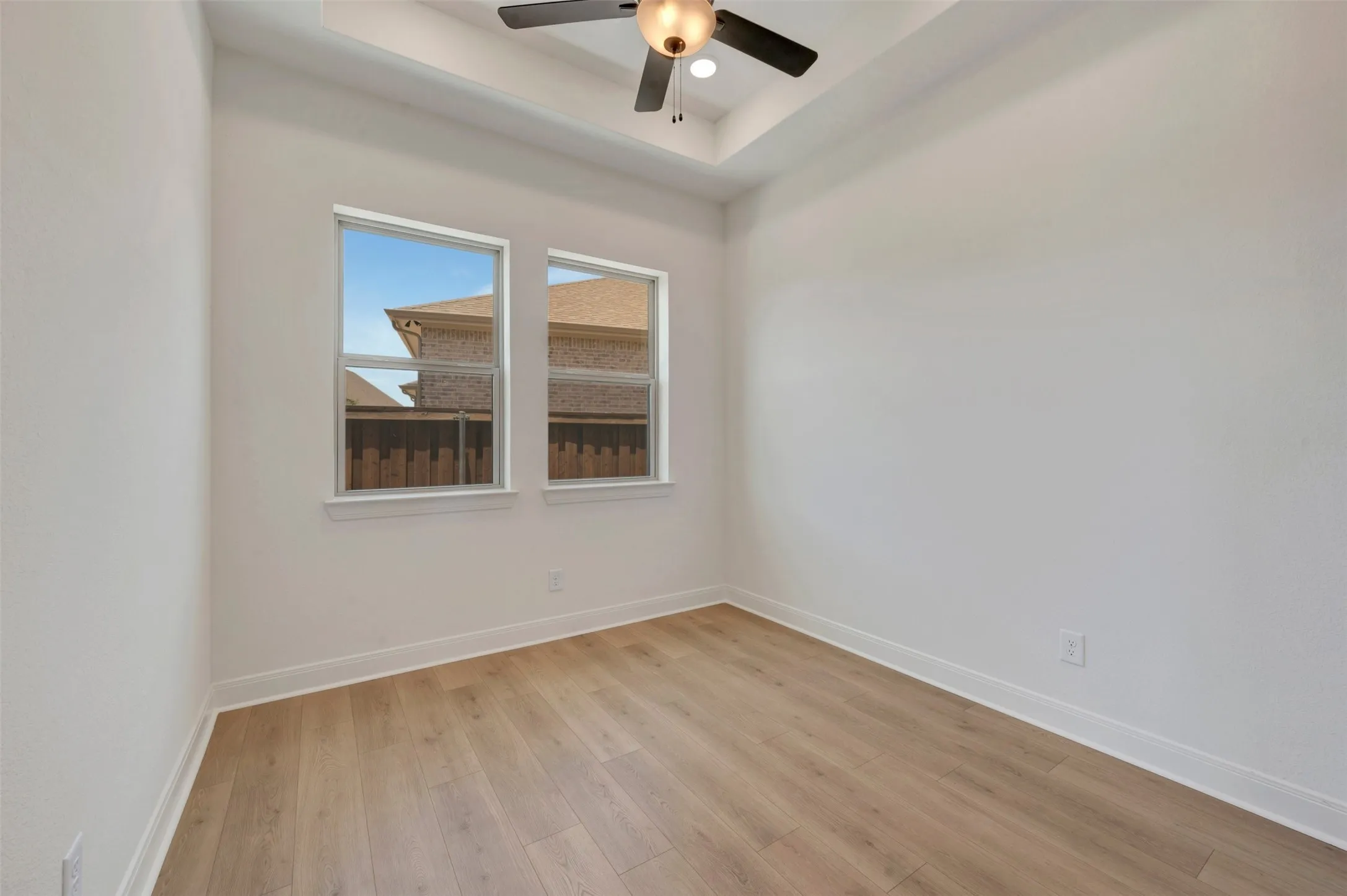 Neutral painted walls with wood-finish flooring