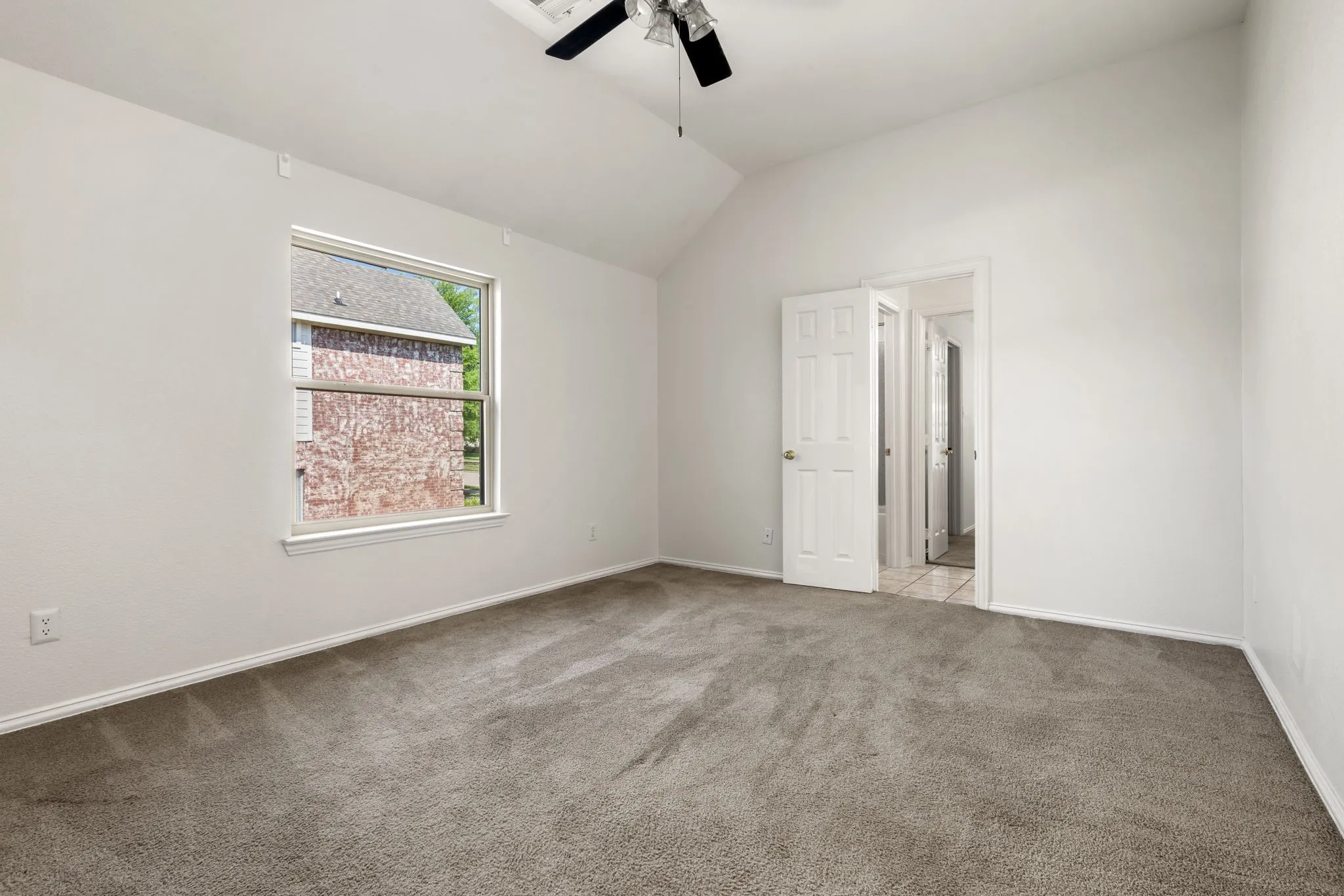 Vaulted ceiling 4th bedroom upstairs  with a huge walk in closet