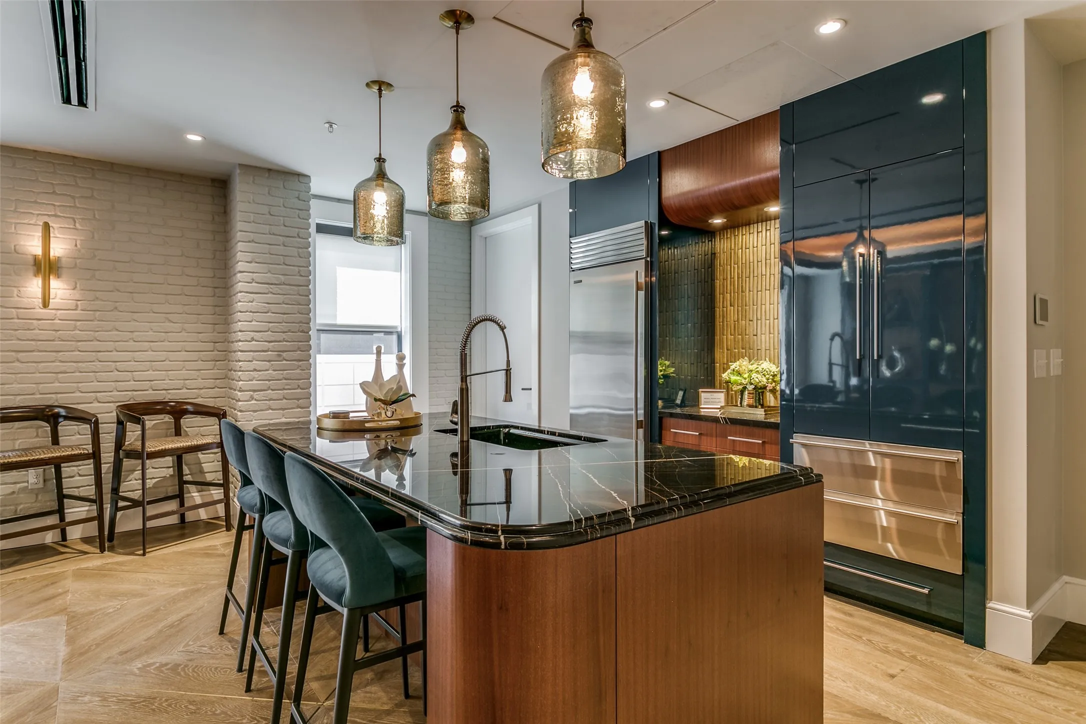 Community entertainment room featuring a kitchen area.