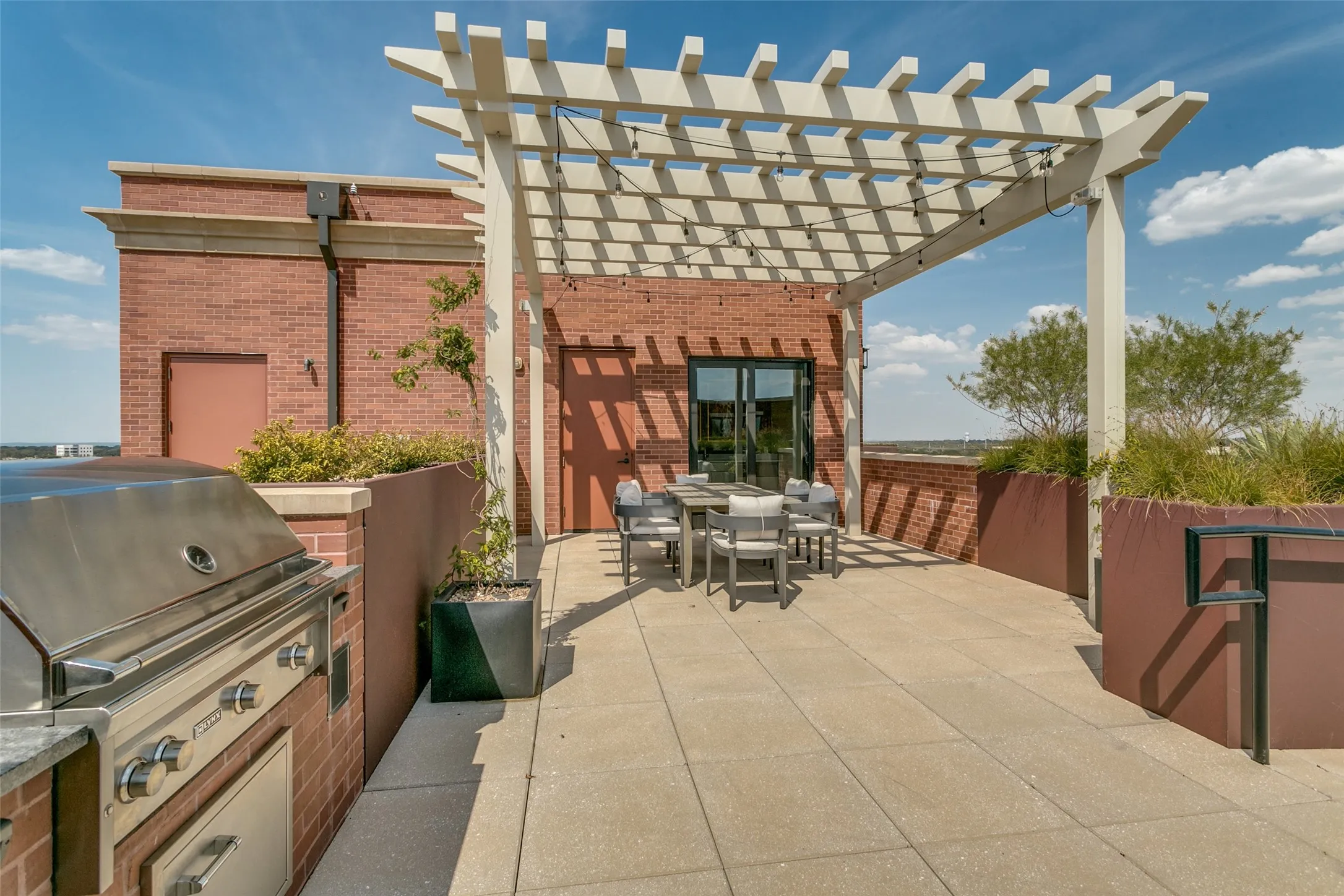 outdoor grill and view of the enclosed kitchenette
