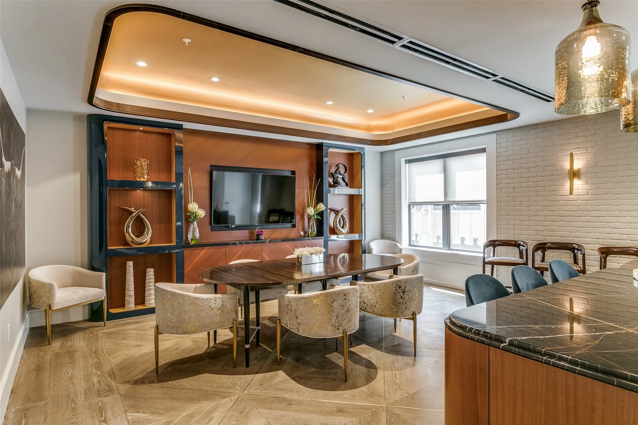 Community entertainment room featuring a kitchen area.