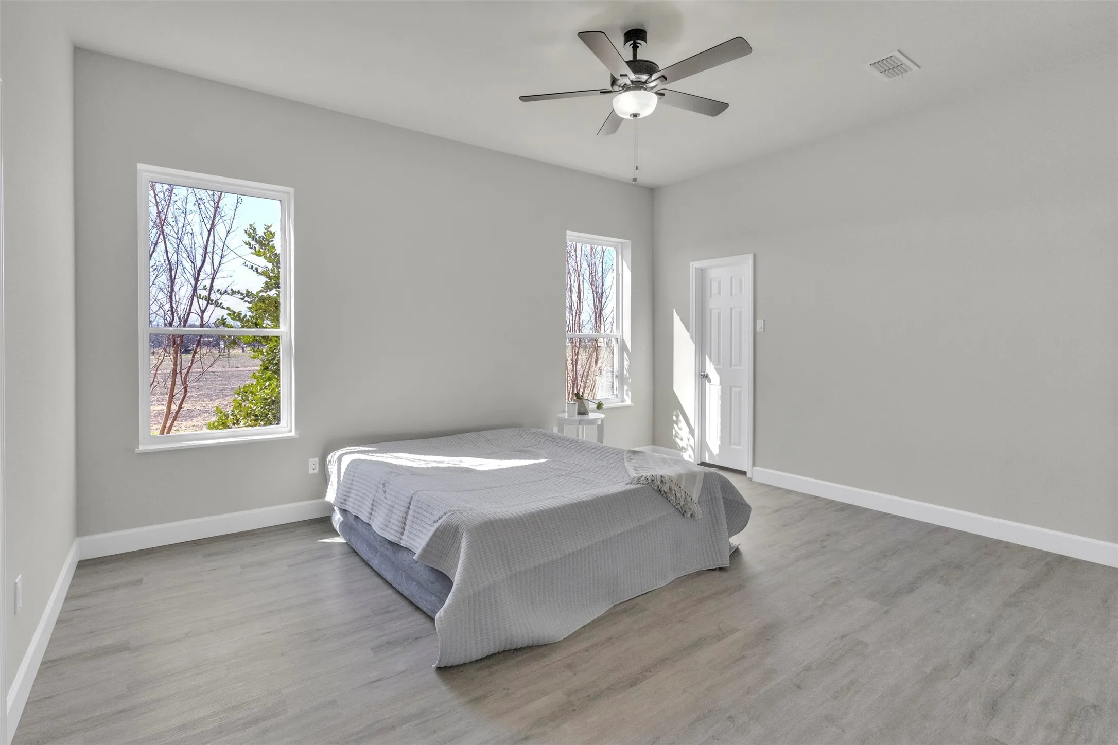Bedroom featuring ceiling fan and light wood-style floors