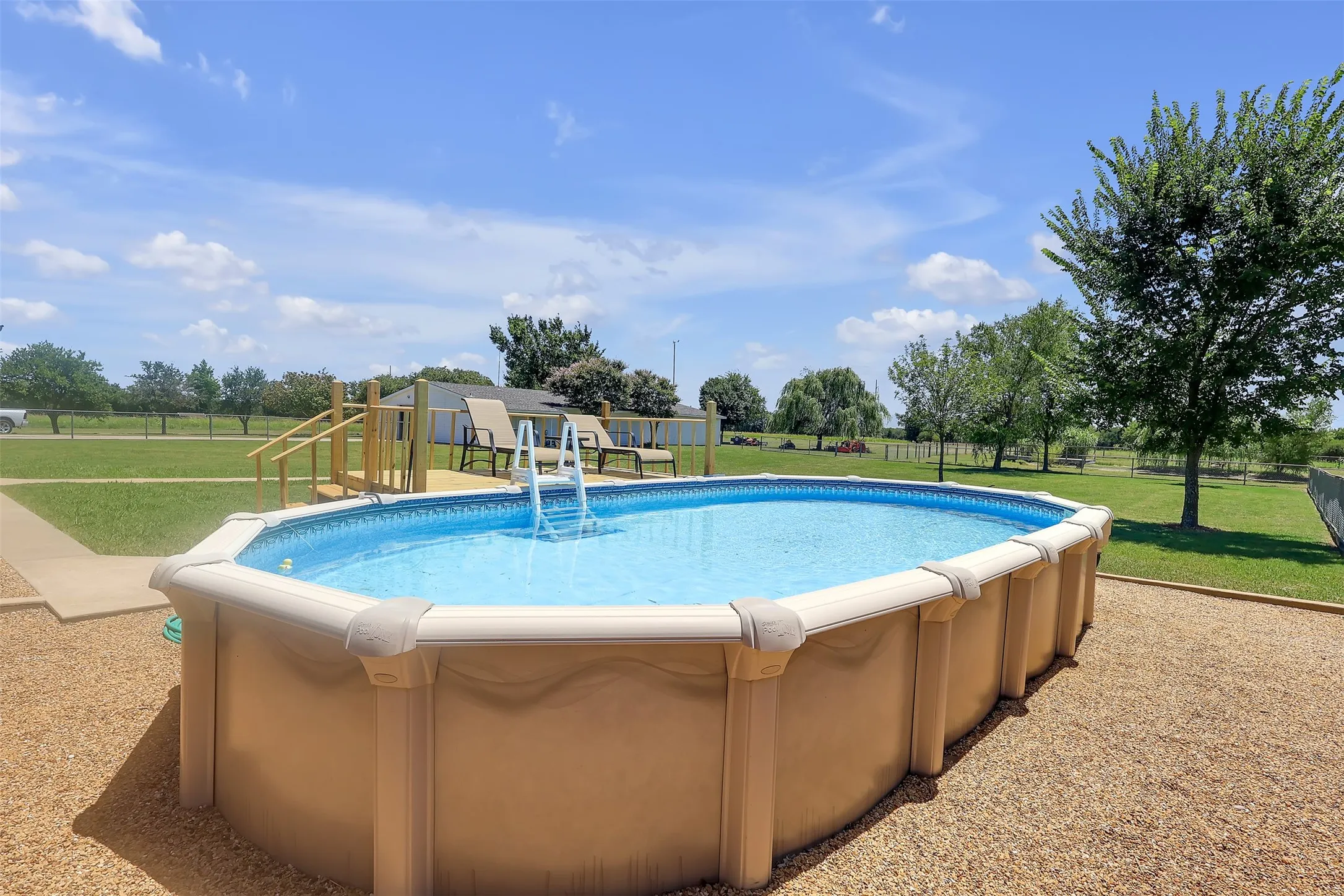 Outdoor pool with a patio area