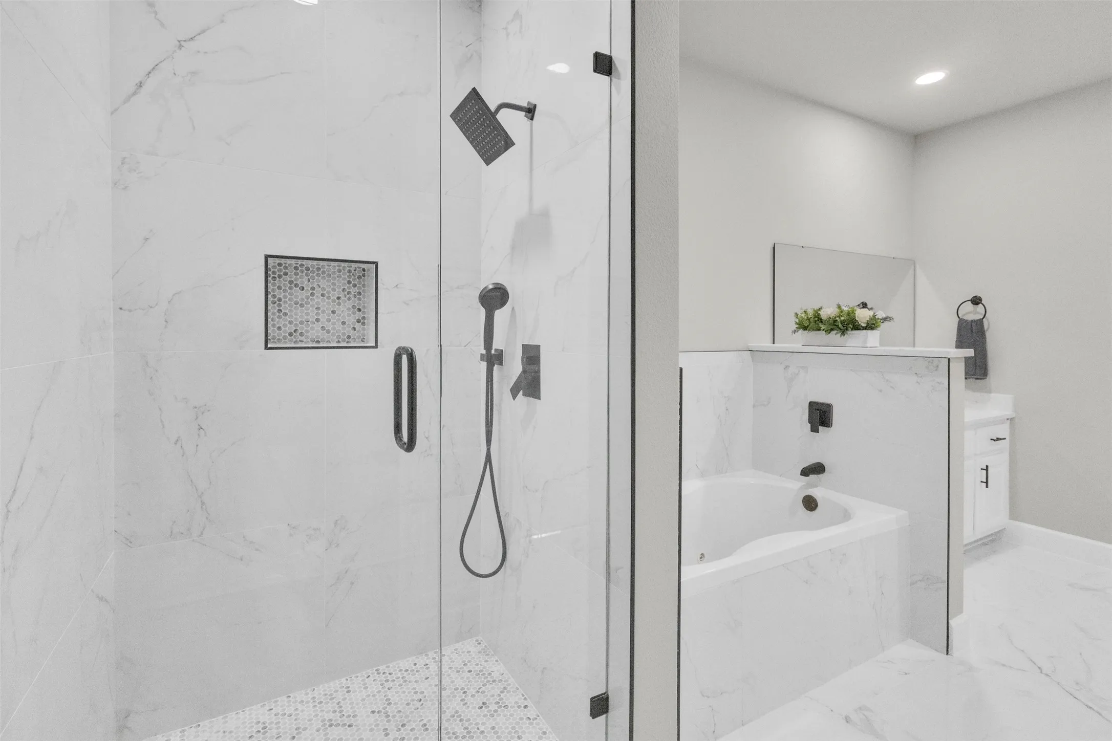 Full bath with a marble finish shower, a bath, vanity, light marble finish flooring, and recessed lighting
