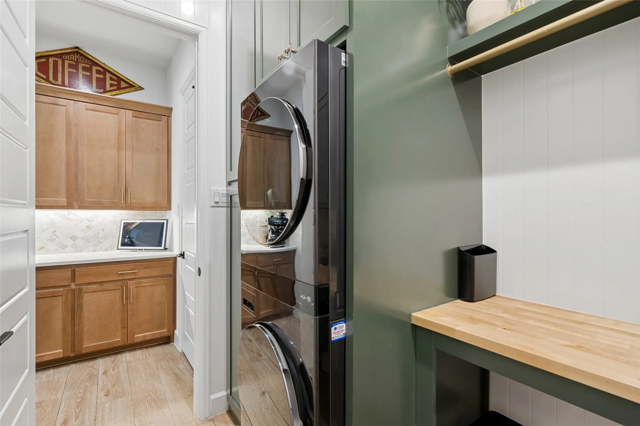 Hanging area with folding below. Lots of storage. Butlers pantry offers even more counter space and storage, walk in pantry to the right of butlers pantry.