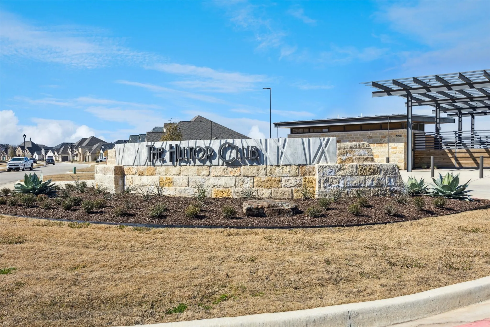 The Hilltop Club, pool and community amenities.