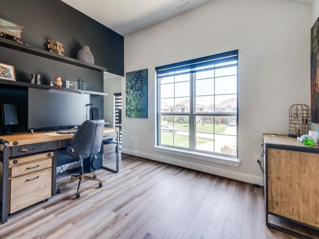 Office featuring healthy amount of natural light and light wood finished floors