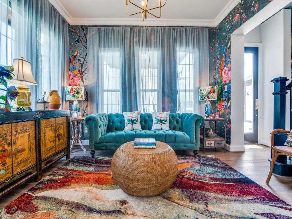 Living area with ornamental molding, wallpapered walls, and wood finished floors