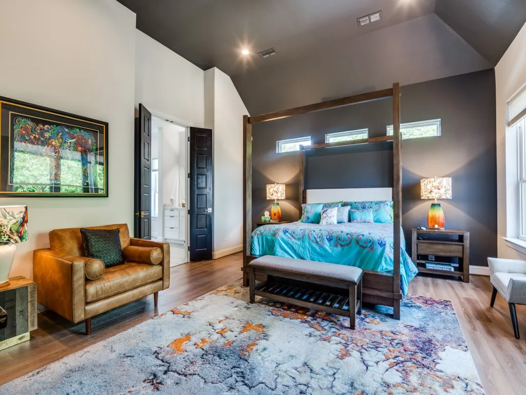Bedroom featuring vaulted ceiling and wood finished floors